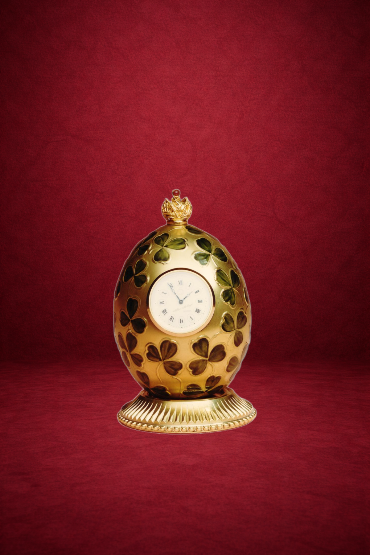 Clover egg creation by Theo Fabergé inspired by clover motifs symbolising luck and prosperity in enamel and gold.