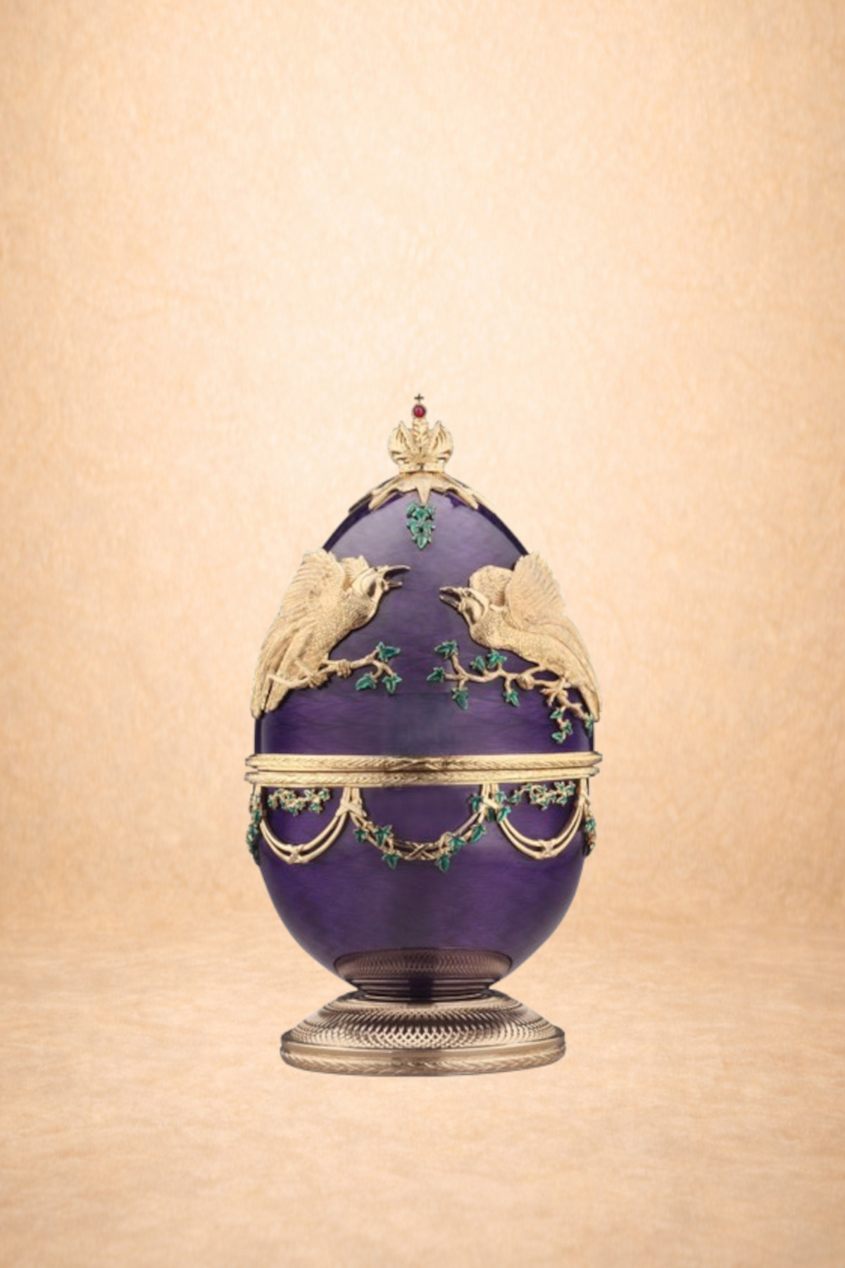 A decorative ceramic or glass urn with a purple base, adorned with gold-colored detailing, two gold doves, and green accents resembling leaves.