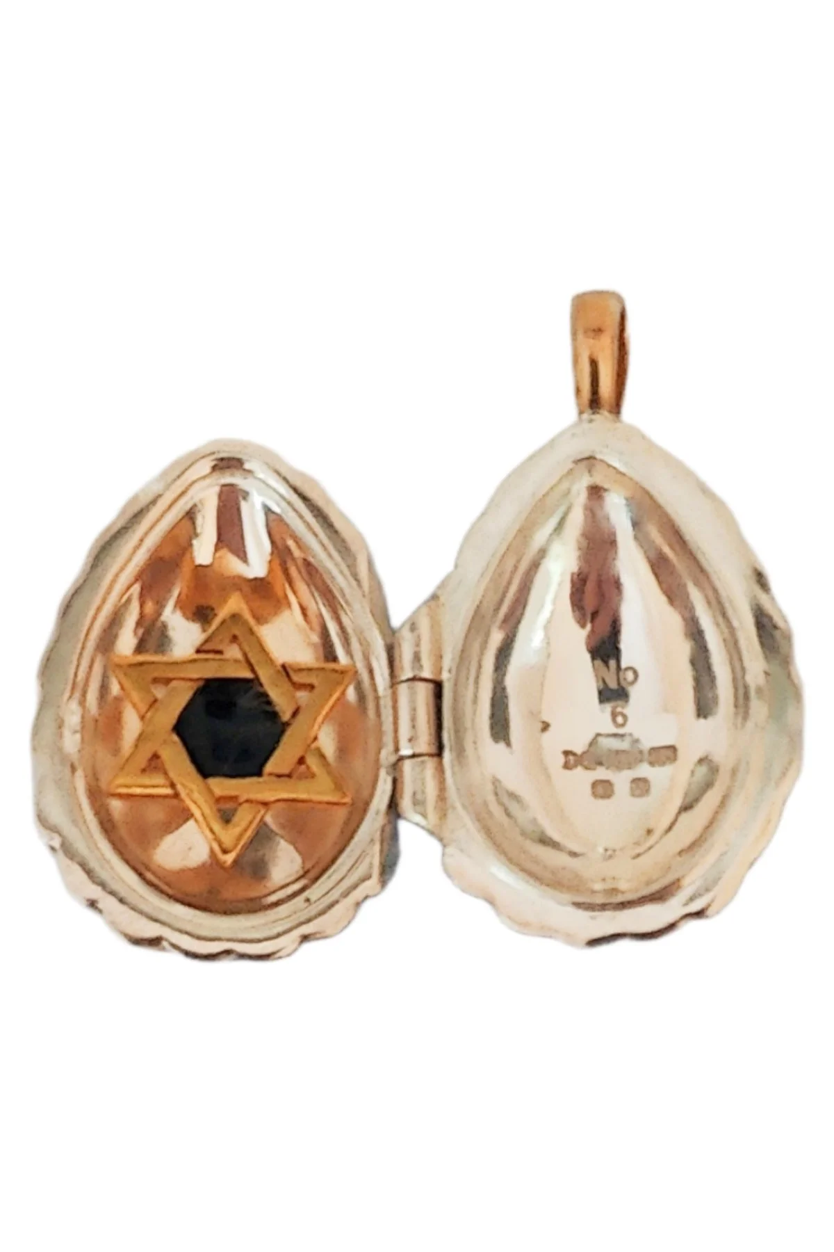 Passion Pendant TFPS962 open to reveal its handcrafted surprise.
