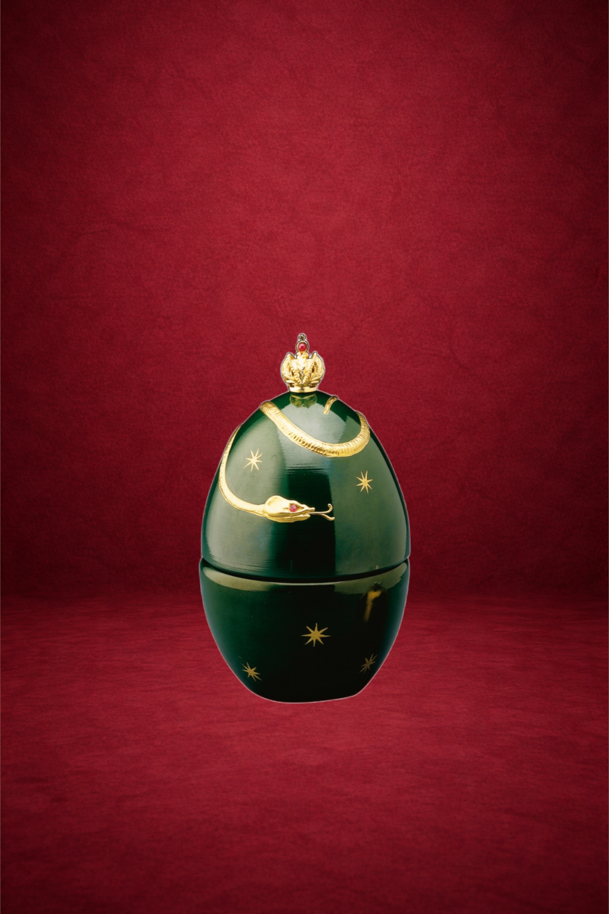 Devil egg creation by Theo Fabergé with dramatic red enamel and gold detailing inspired by mythic symbolism.