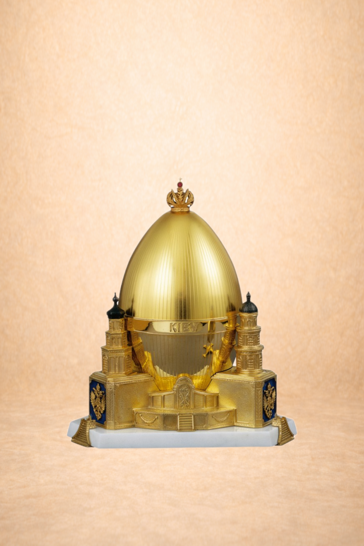 Model of the Saint Michael's Golden Domed Monastery in Kiev, Ukraine, featuring a golden dome, small towers, and a base with blue and gold details.
