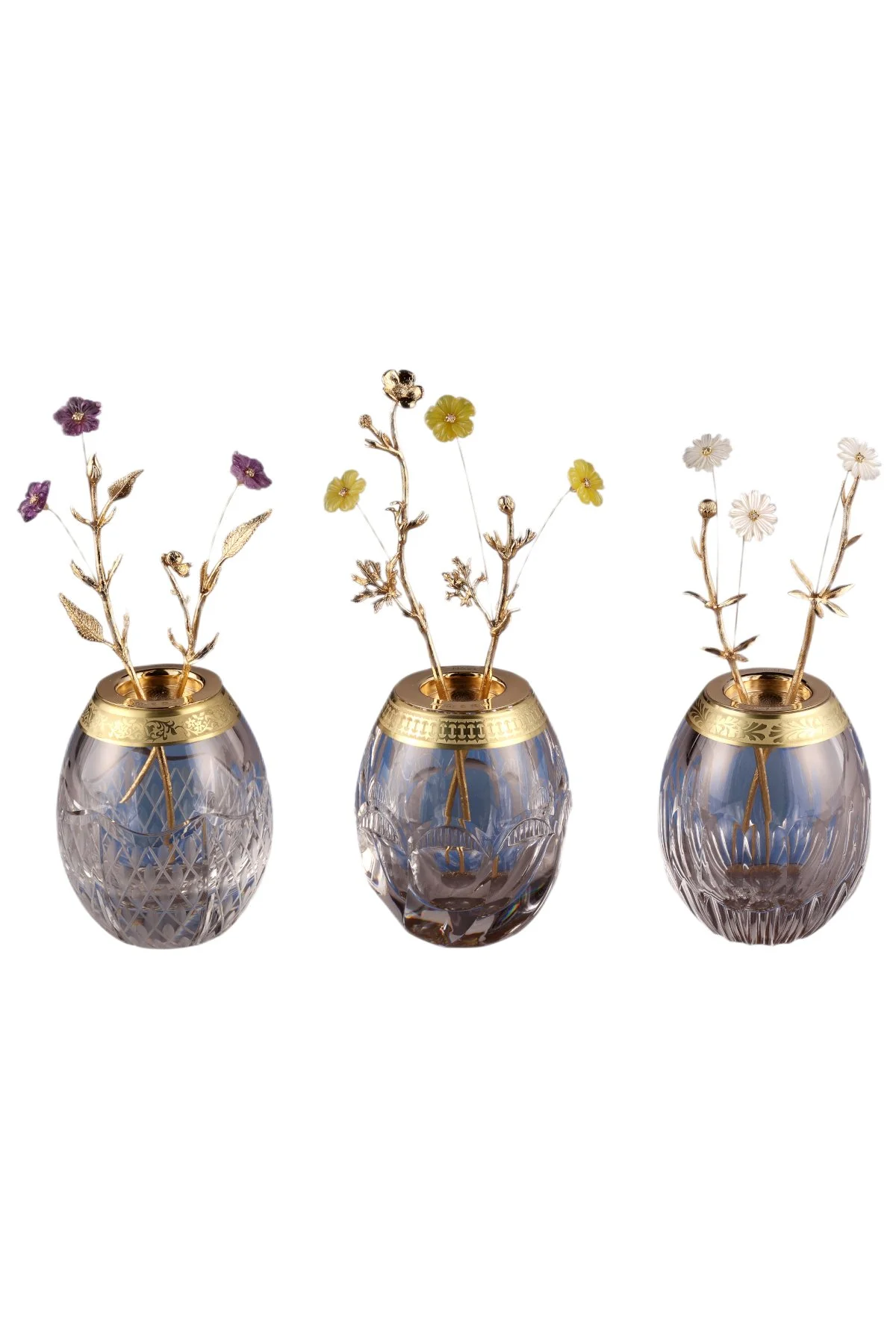Tremblant Buttercup, Daisy and Violet Eggs, an original Theo Fabergé Egg creation in gold and diamonds.