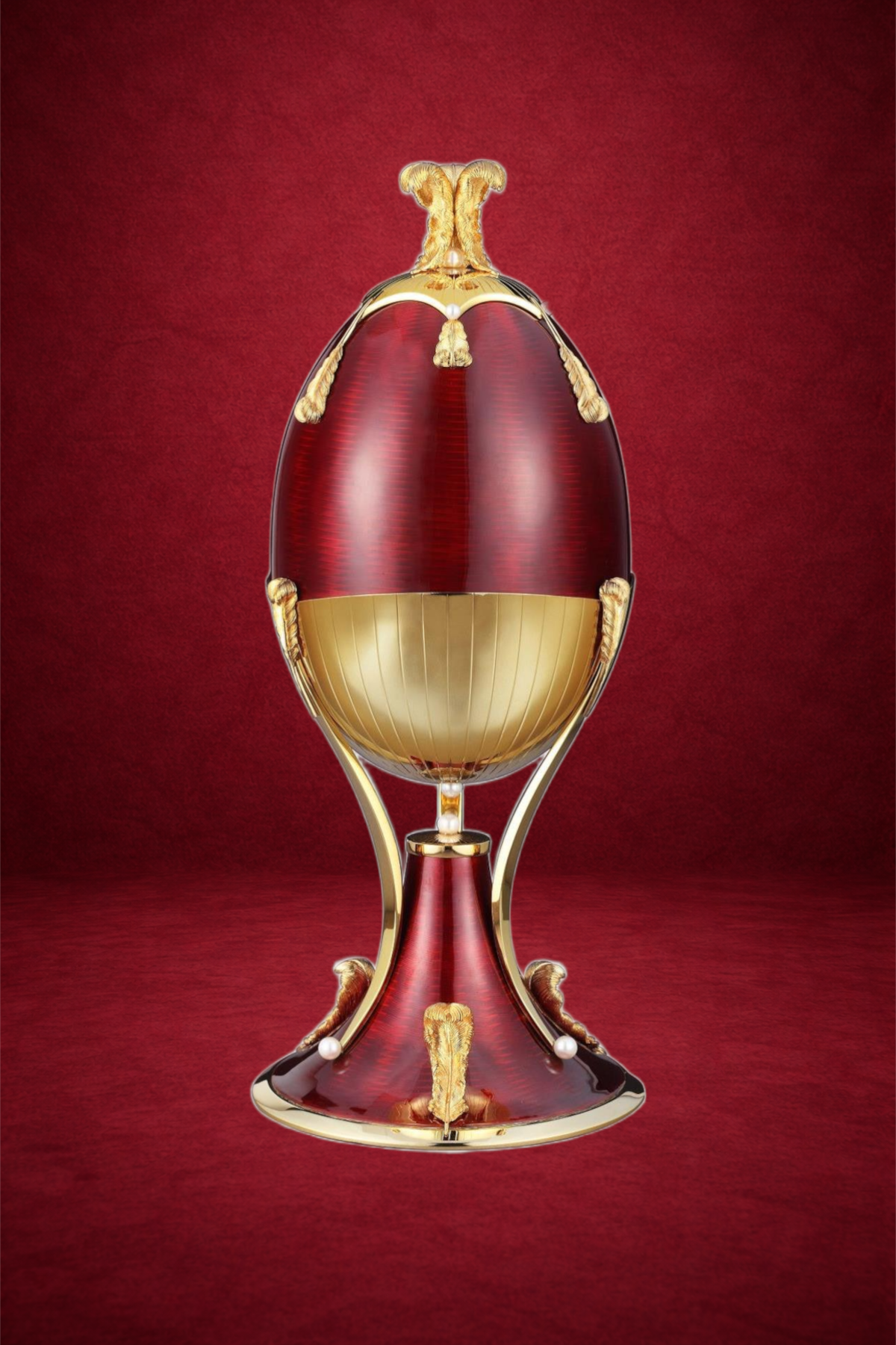 Firebird egg creation by Theo Fabergé inspired by the Russian Firebird legend crafted with vibrant enamel and gold.