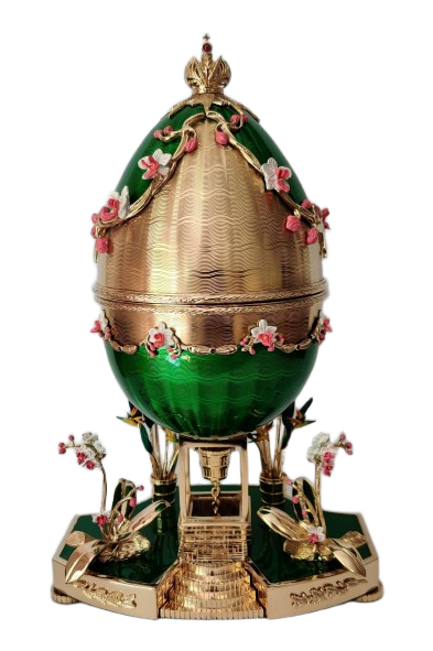 Theo Fabergé Garden Egg featuring green enamel, gold guilloché decoration and floral details in a handcrafted Fabergé-style design.