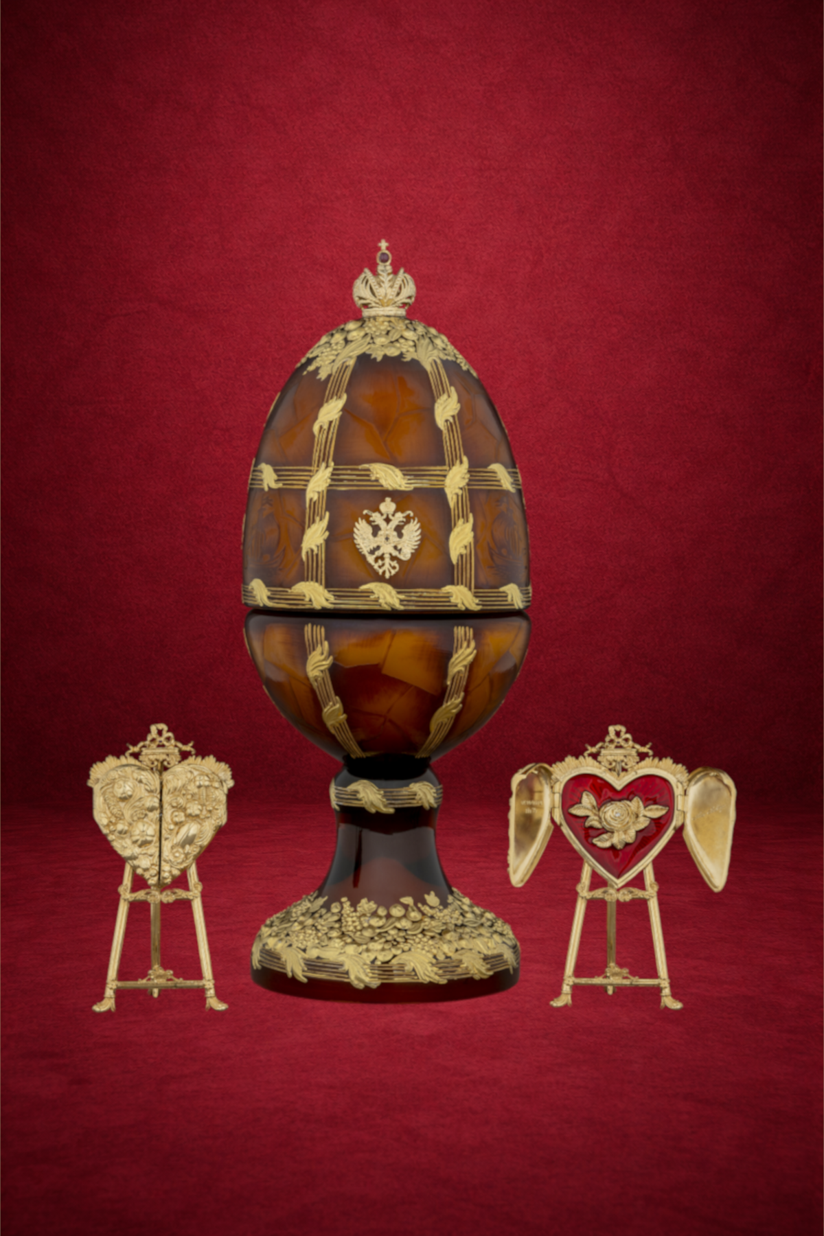 Amber egg creation by Theo Fabergé incorporating warm amber tones and handcrafted enamel and gold detailing.