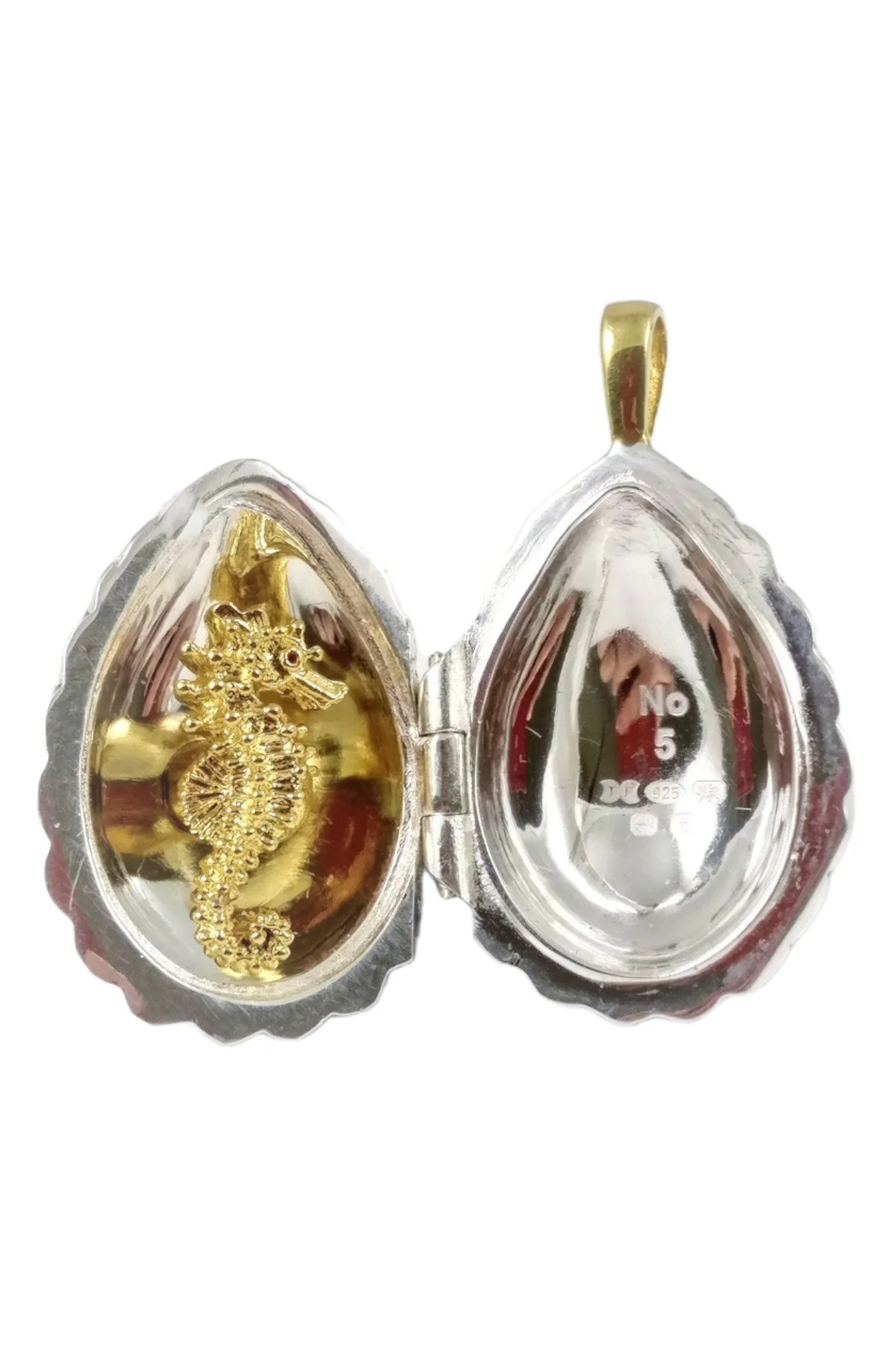 Passion Pendant TFPS964 open to reveal its handcrafted surprise.