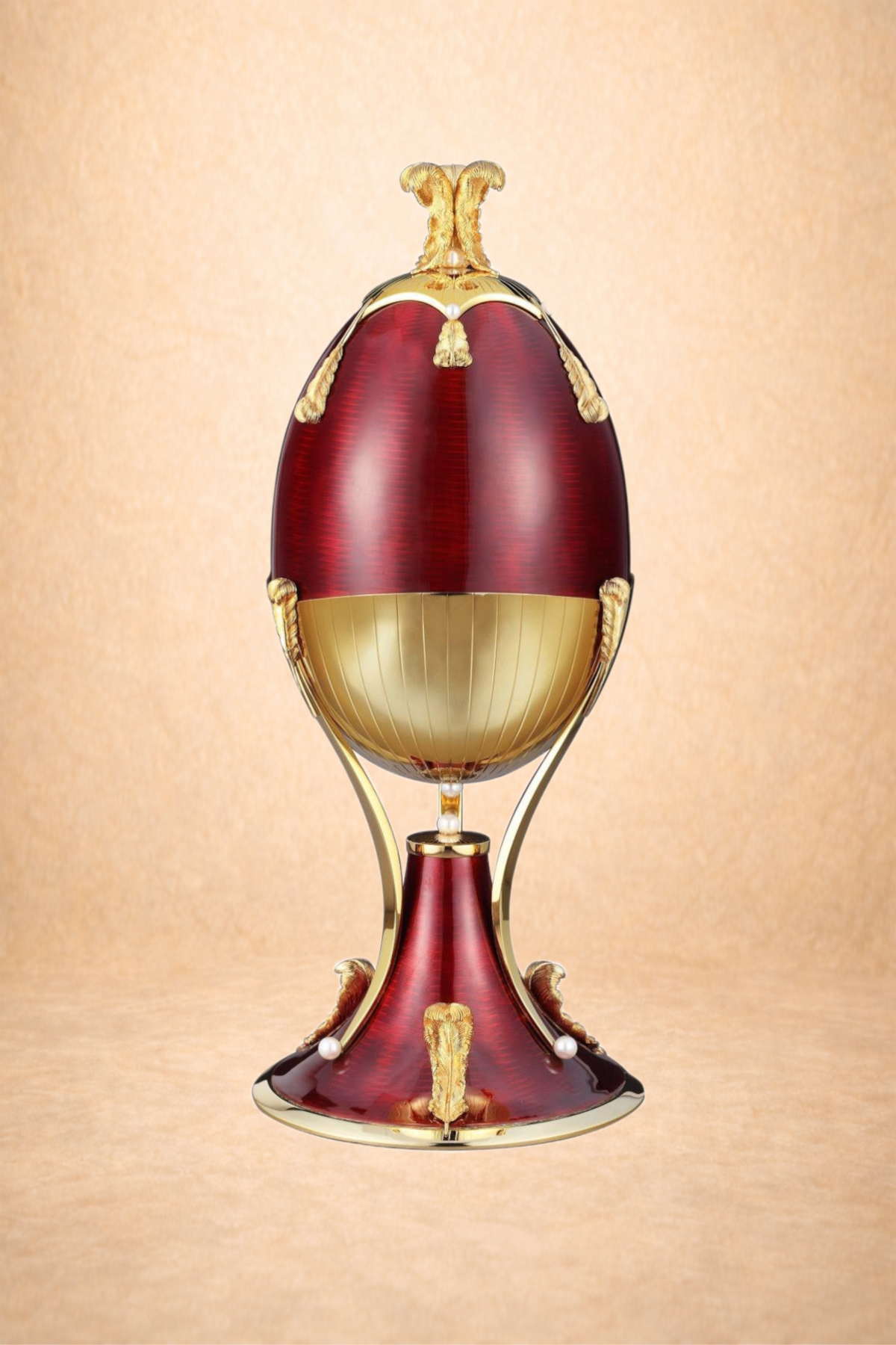 A decorative egg-shaped object with ornate gold accents, red and gold panels, and pearl details, set against a light beige background.
