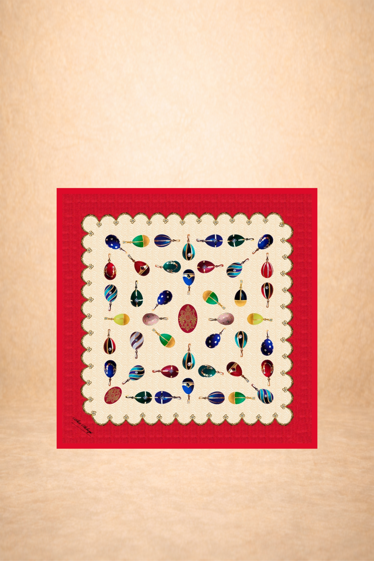 A decorative display of colorful glass ornaments on a white cloth with red border, arranged in rows and hanging from their hooks.