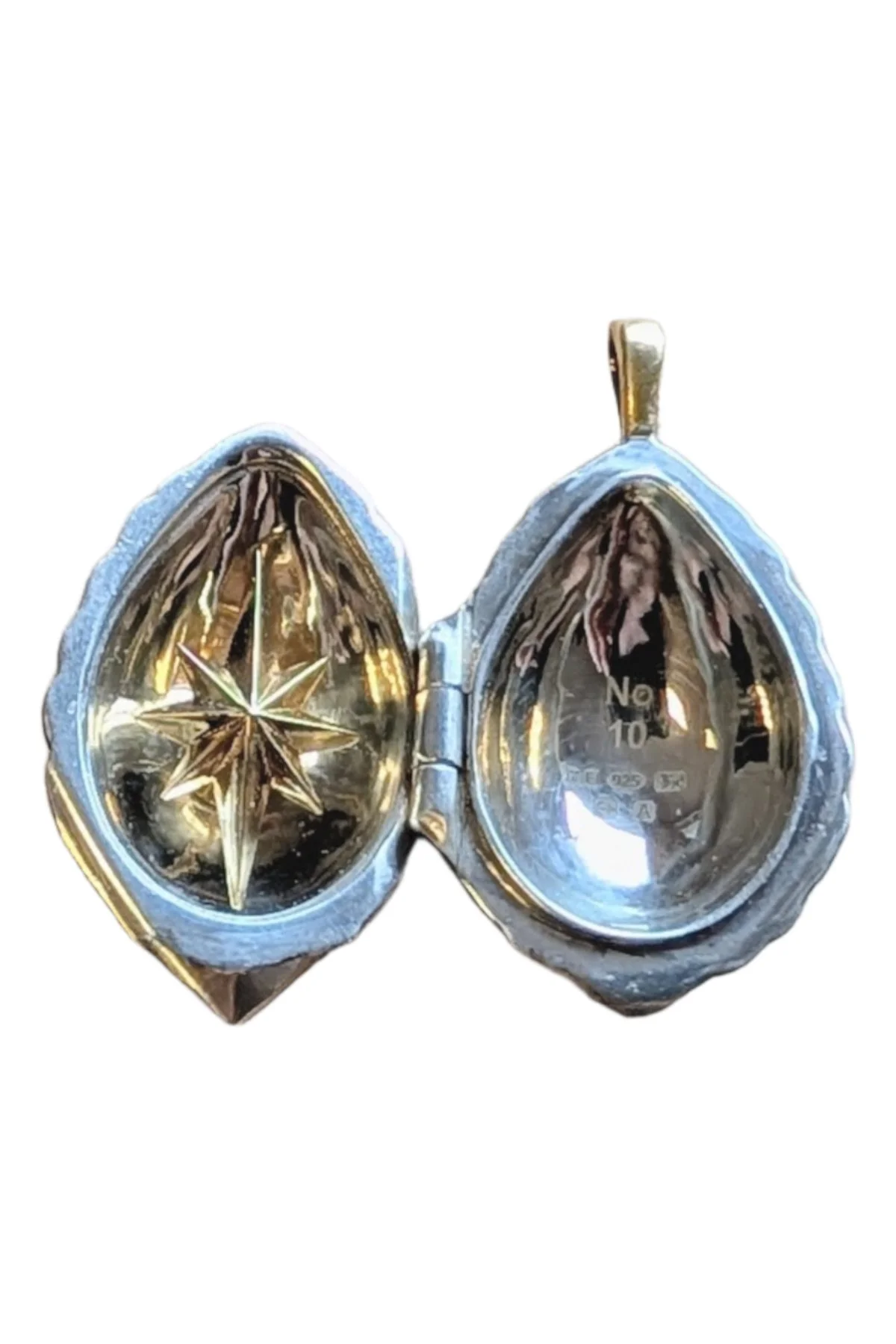 Passion Pendant TFPS970 open to reveal its handcrafted surprise.