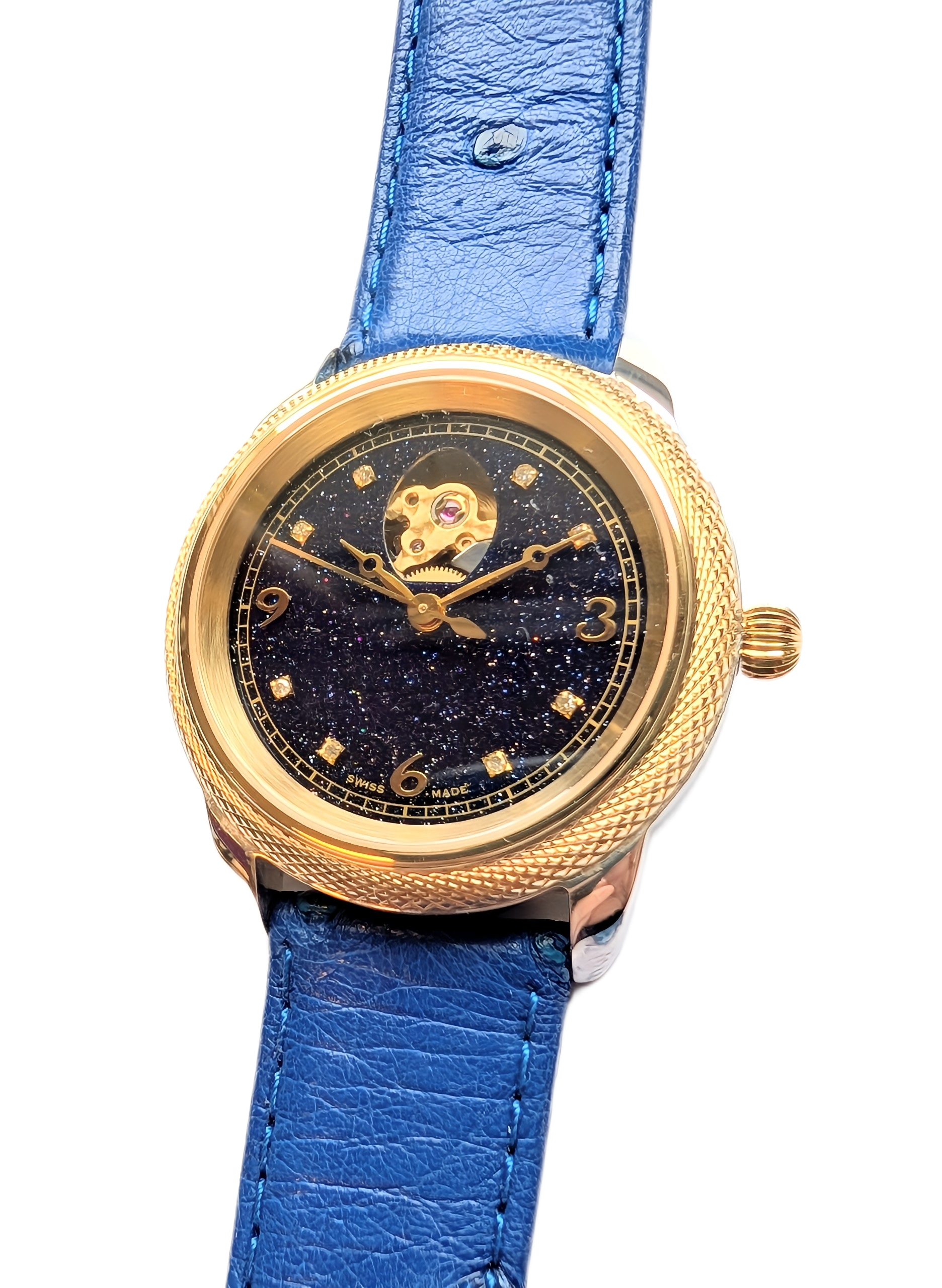 Theo Fabergé Series 8 ladies watch model TF802 featuring stellar goldstone dial, 18 kt yellow gold bezel, sterling silver case and diamond hour markers.