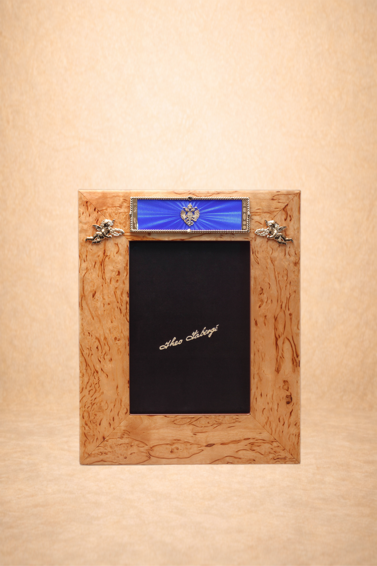 Wooden photo frame with a blue ribbon and a black photo with the name 'Ilea Stoberg' inside.