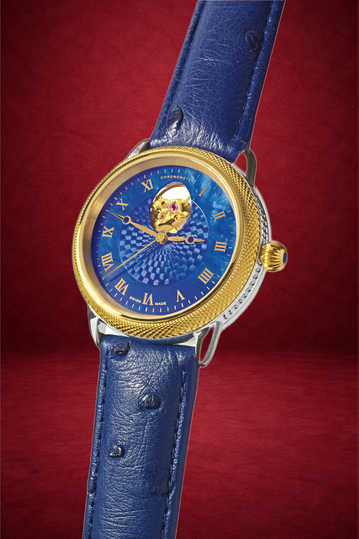 Theo Fabergé Series 4 chronometer model TF409 with 18 kt yellow gold bezel, sterling silver case and blue enamel dial featuring the Fabergé egg cut-out display.