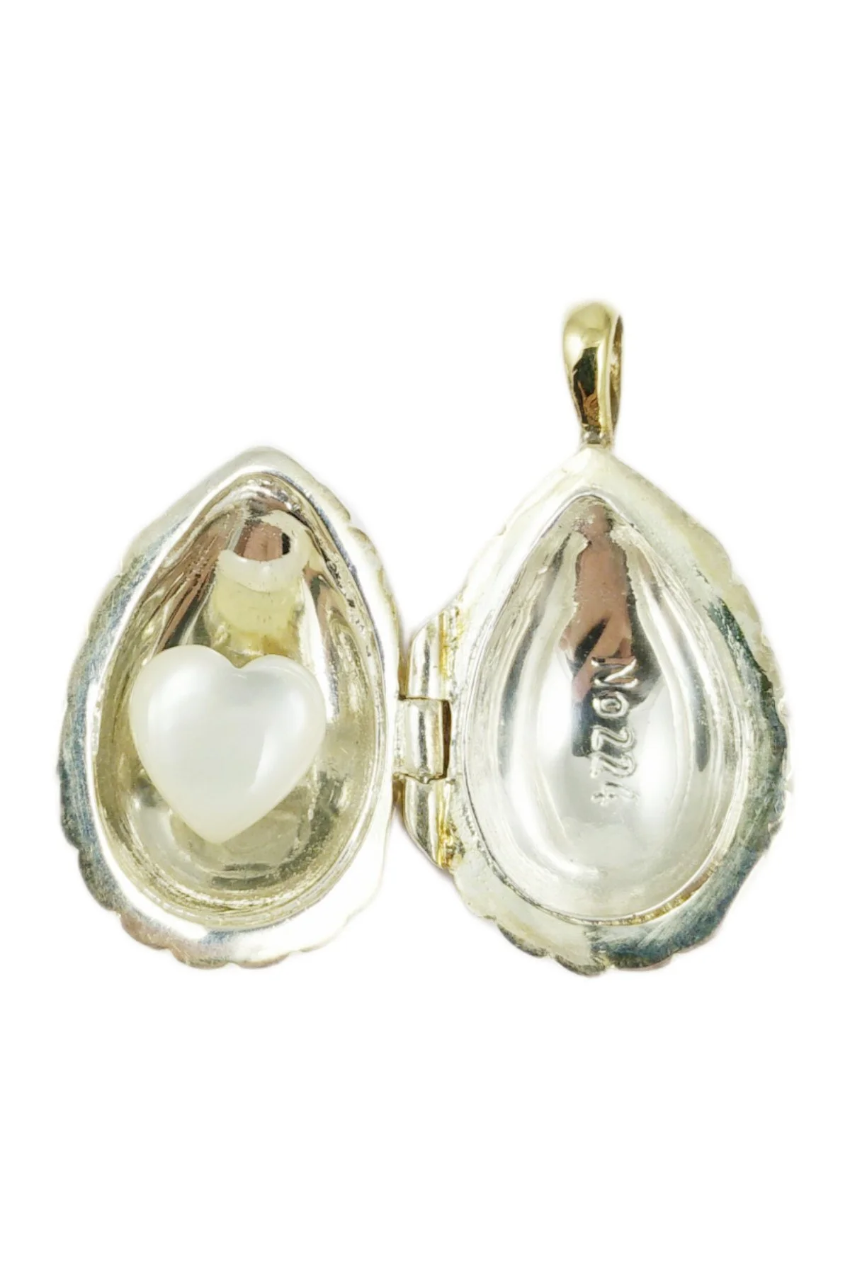 Passion Pendant TFPS952 open to reveal its handcrafted surprise.