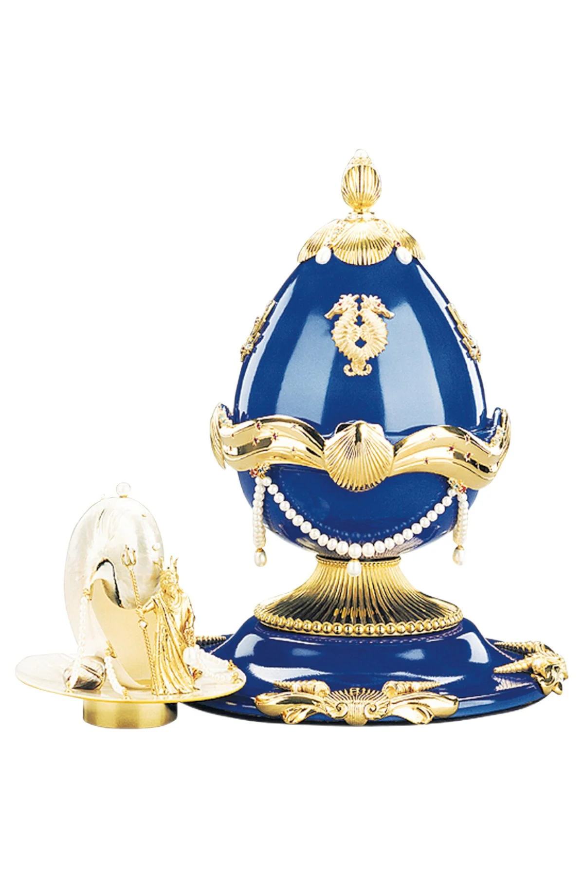Sea Fountain Egg open to reveal its handcrafted surprise.