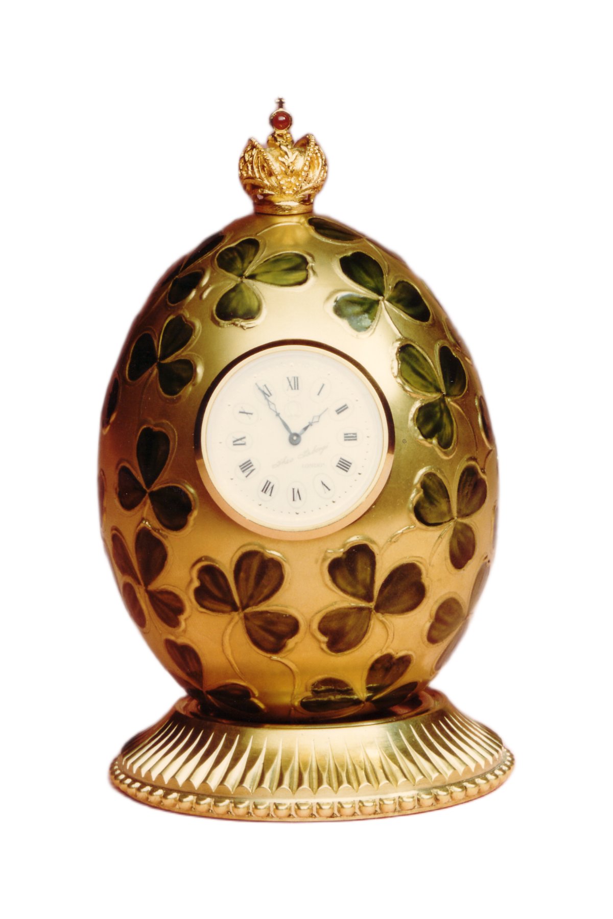 Clover egg creation by Theo Fabergé inspired by clover motifs symbolising luck and prosperity in enamel and gold.