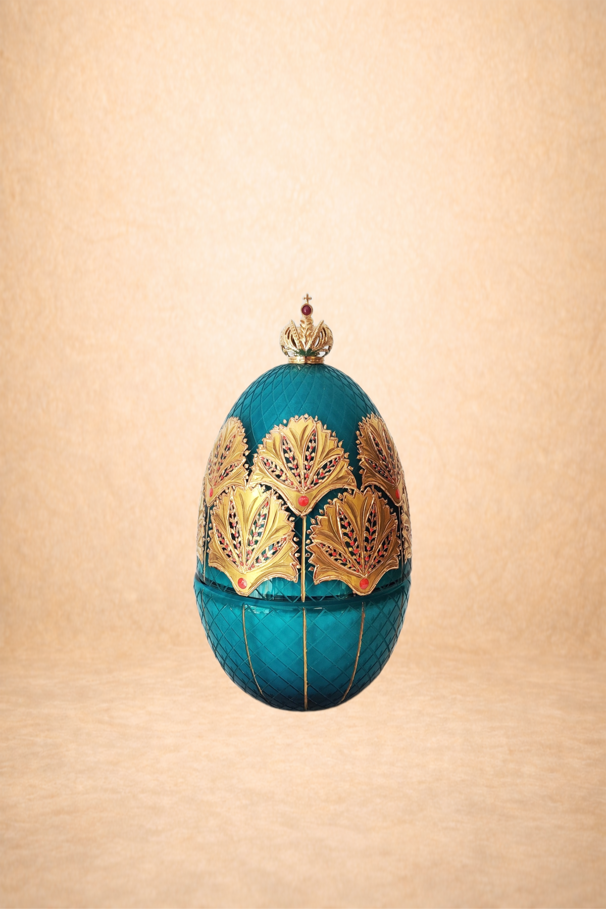 An ornate, decorative egg-shaped object with a turquoise and gold design set against a beige background.