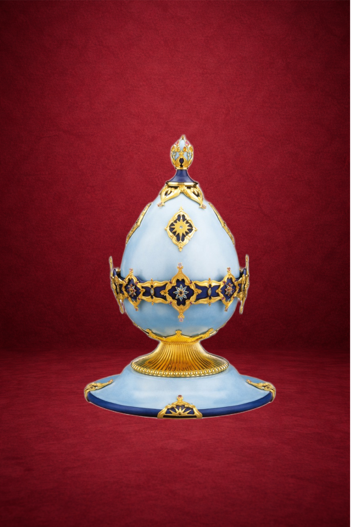 Millenium Fountain Egg creation by Theo Fabergé decorated with ornamental garland motifs in gold and enamel.