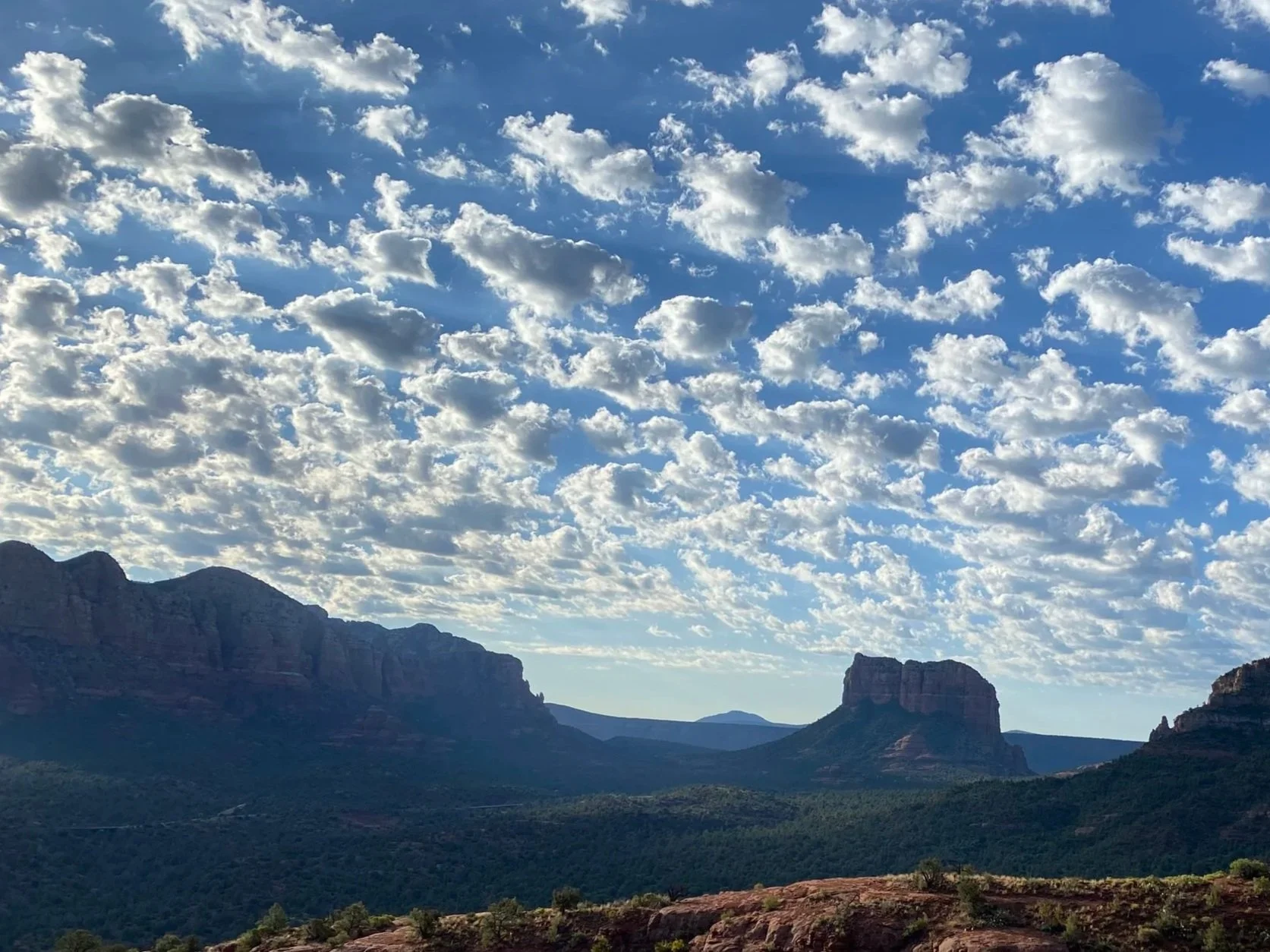 Sedona red rock formations under a warm desert sky, capturing the beauty of community and intentional living in the American Southwest.