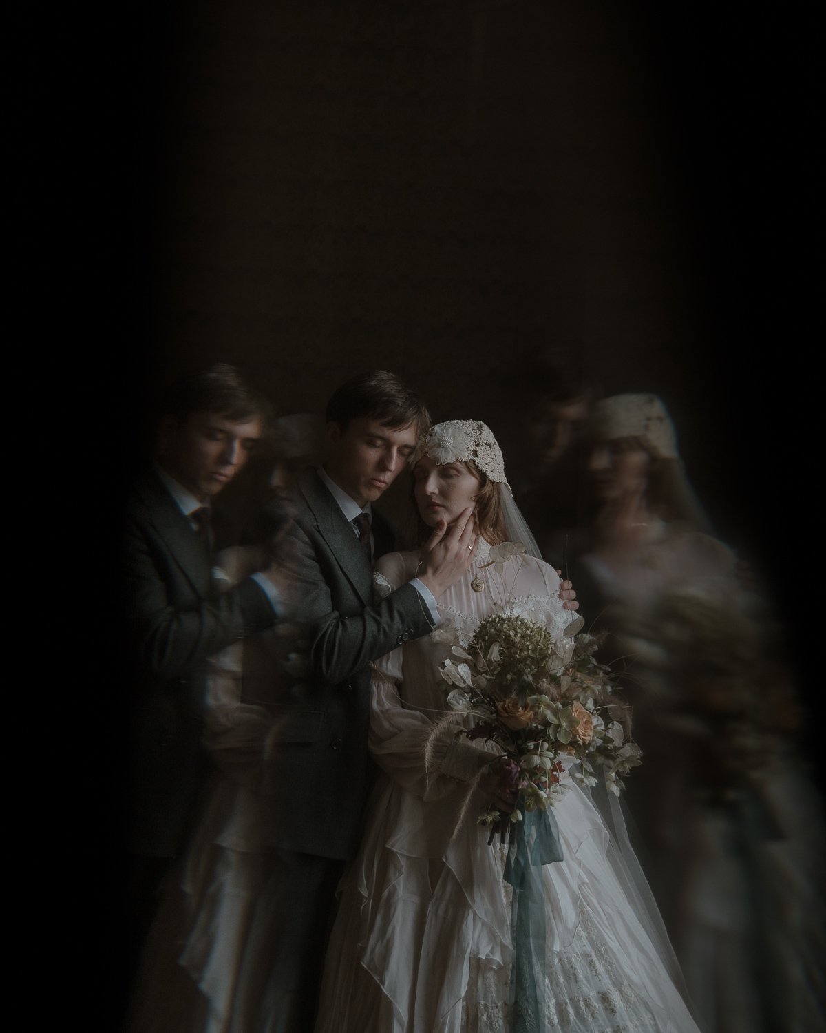 A vintage-style wedding photo of three couples with blurred reflections, showing a bride in a white dress and veil holding a bouquet, and two grooms in suits.