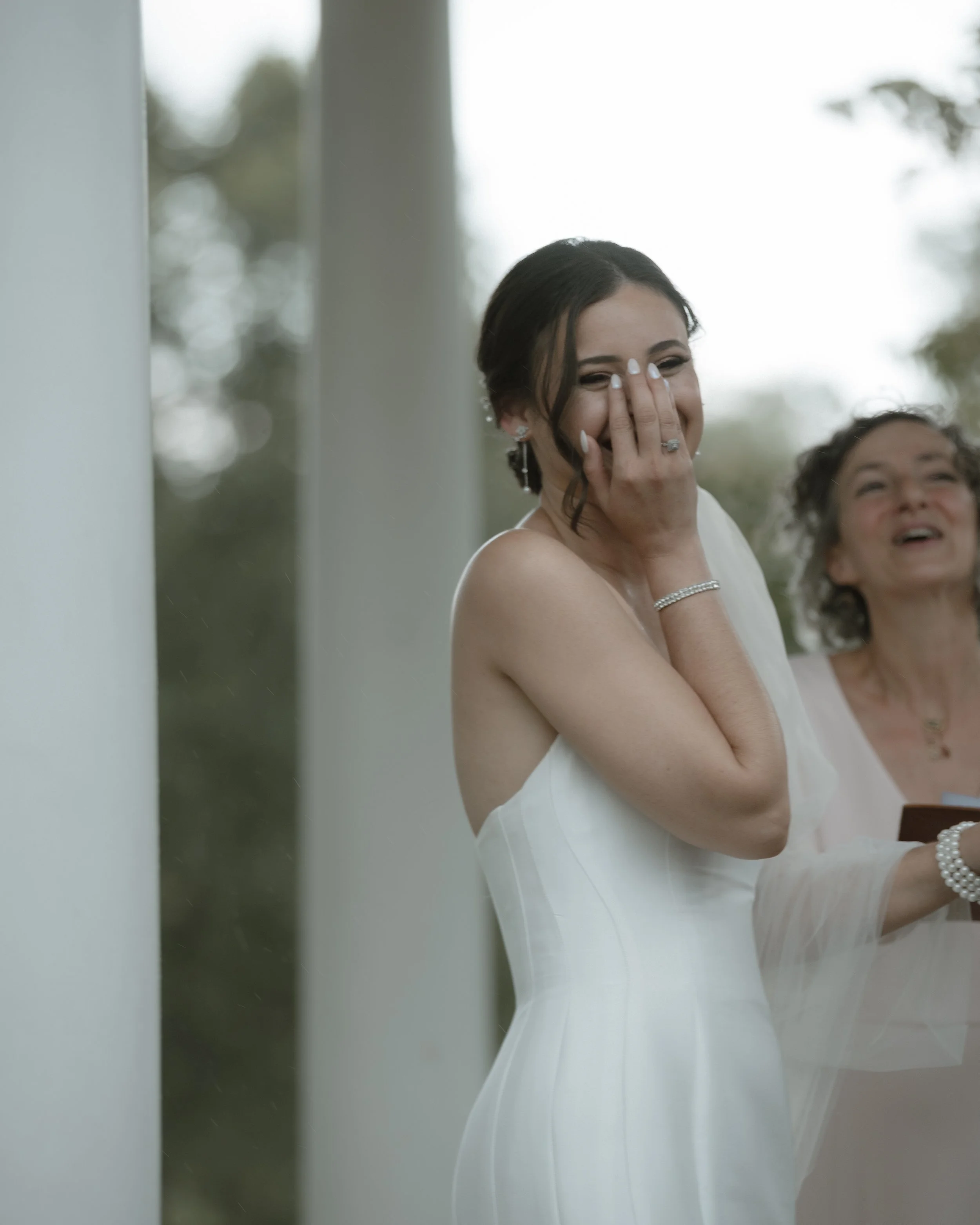 Bride laughing candidly before ceremony — documentary wedding photographer Pennsylvania