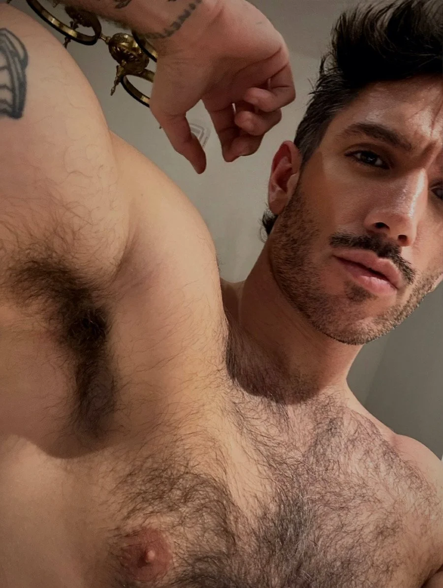 François posing shirtless, showing off the armpits