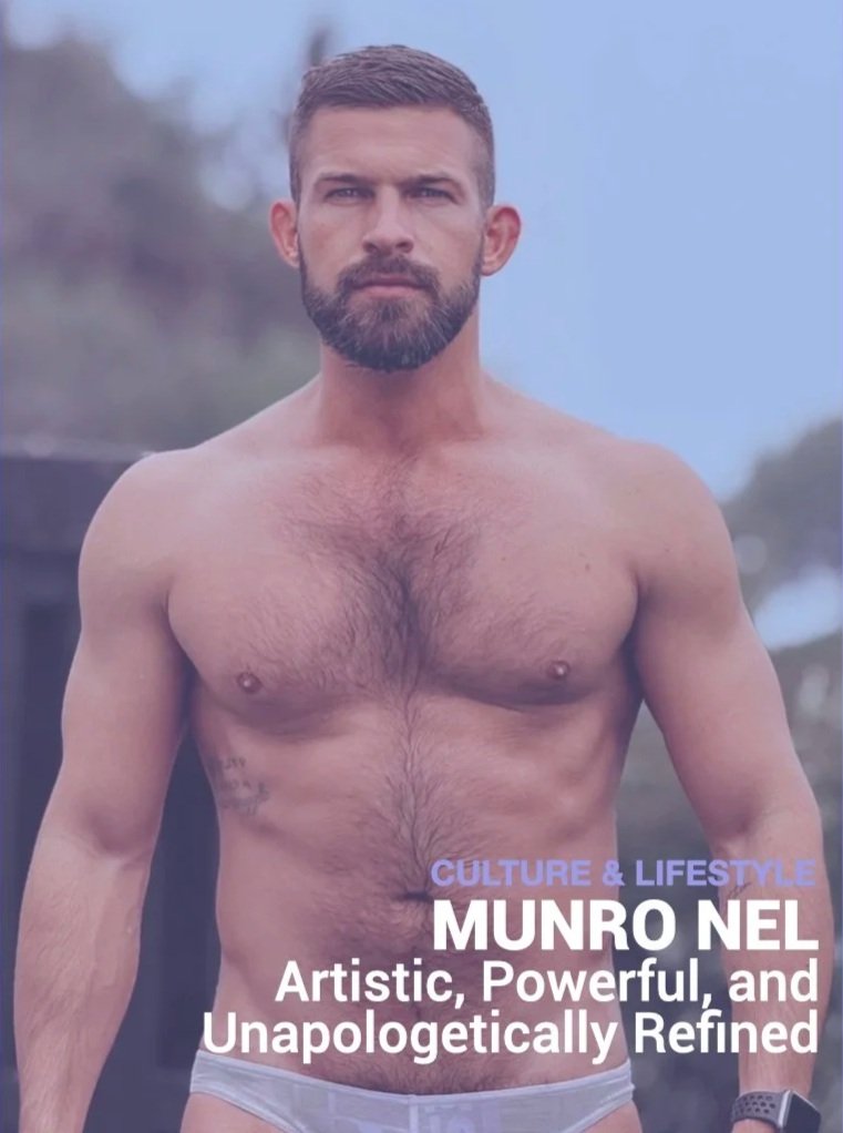 A shirtless man with a beard and short hair standing outdoors during the daytime. He has tattoos on his left side and is wearing white underwear. The background shows cloudy skies and blurred trees. Text at the bottom reads: 'CULTURE & LIFESTYLE MUNRO NEL Artistic, Powerful, and Unapologetically Refined.'