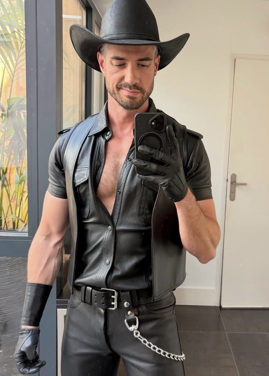 Thibaud wears full black leather and a leather cowboy hat