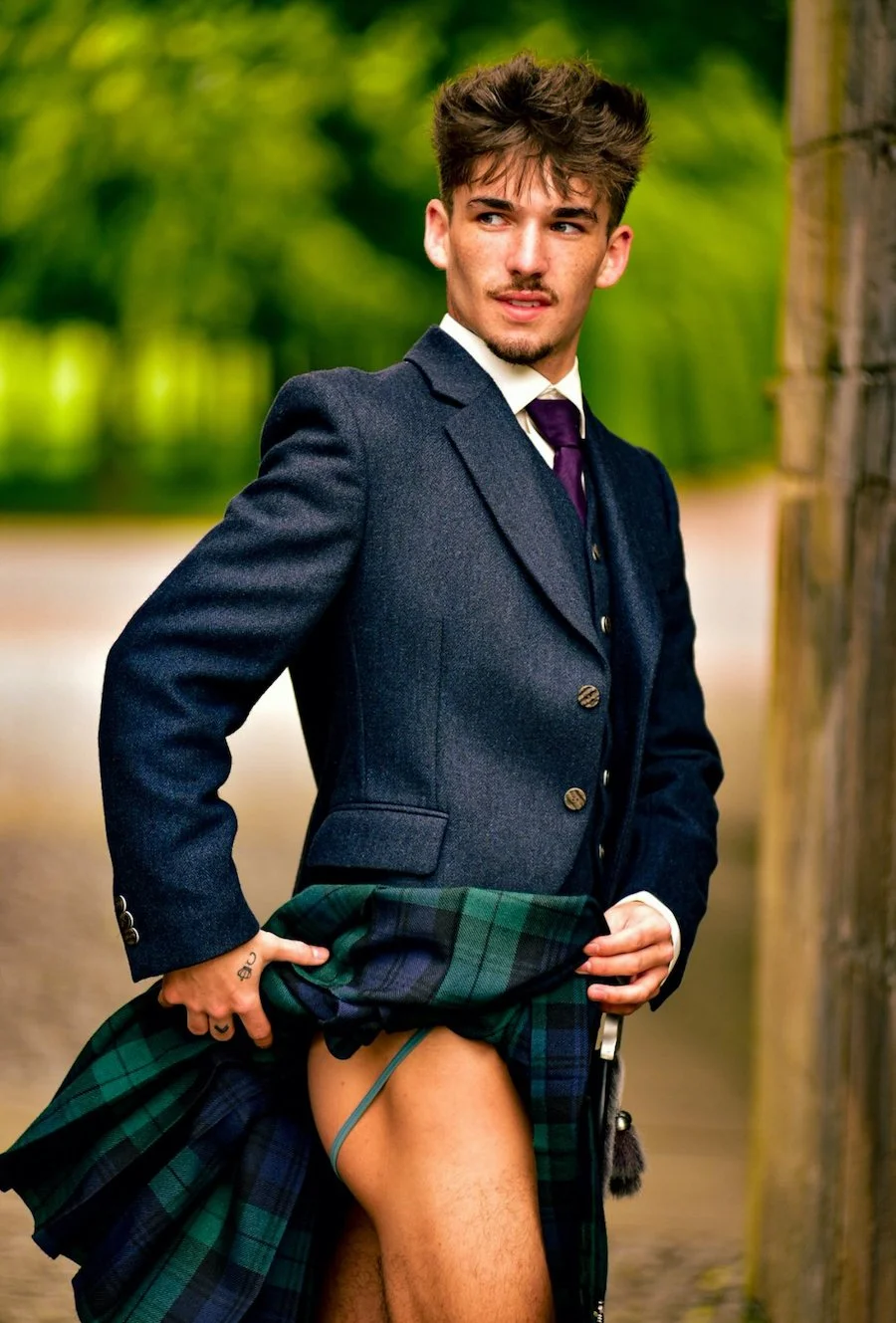 Darryl posing in his Scottish costume and jockstrap