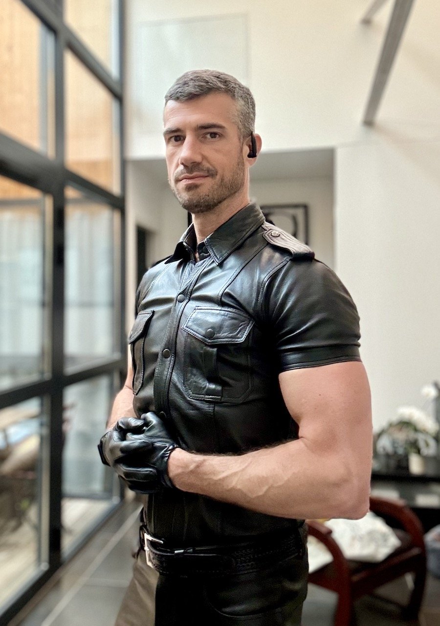 Thibaud posing in a full leather costume
