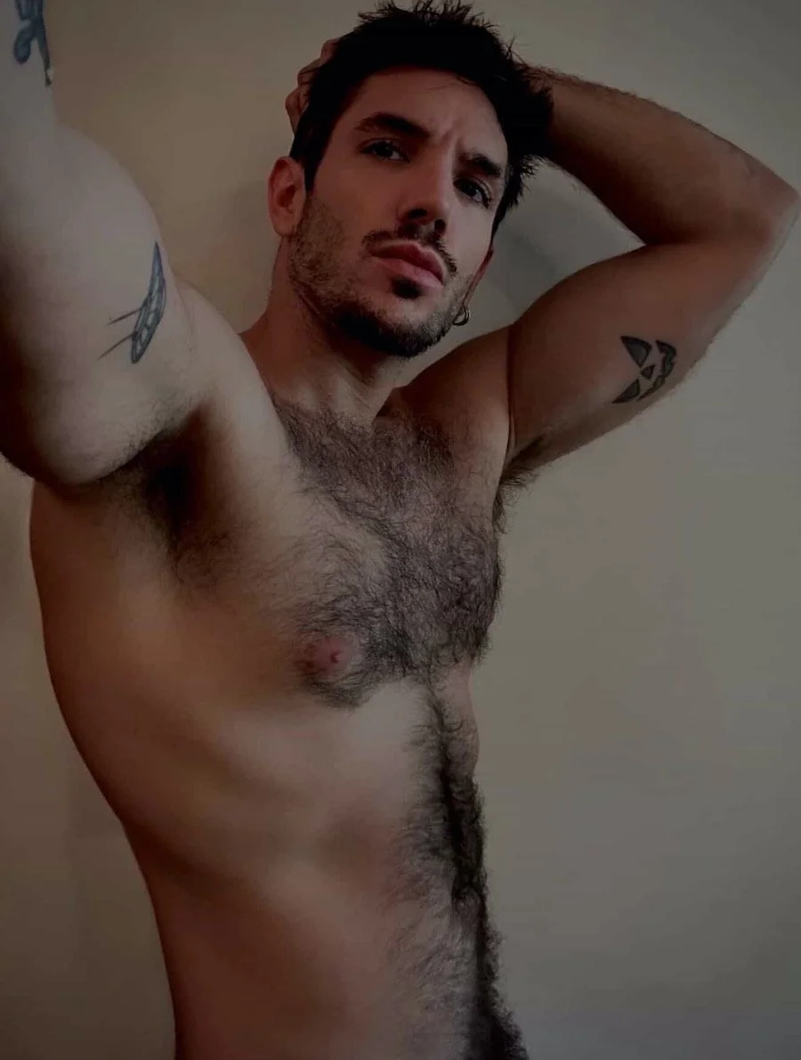 François posing shirtless, showing off armpits