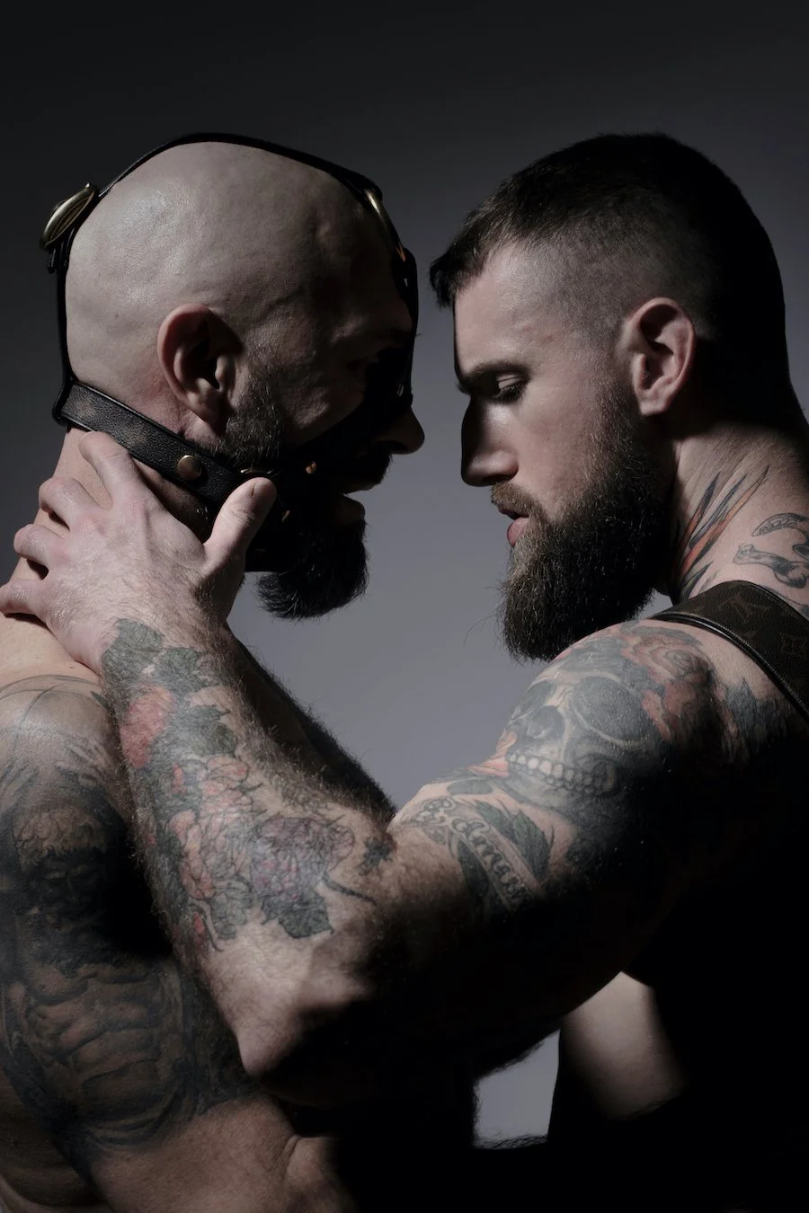 Two men in leather gears, photo taken by Raf Gaweda