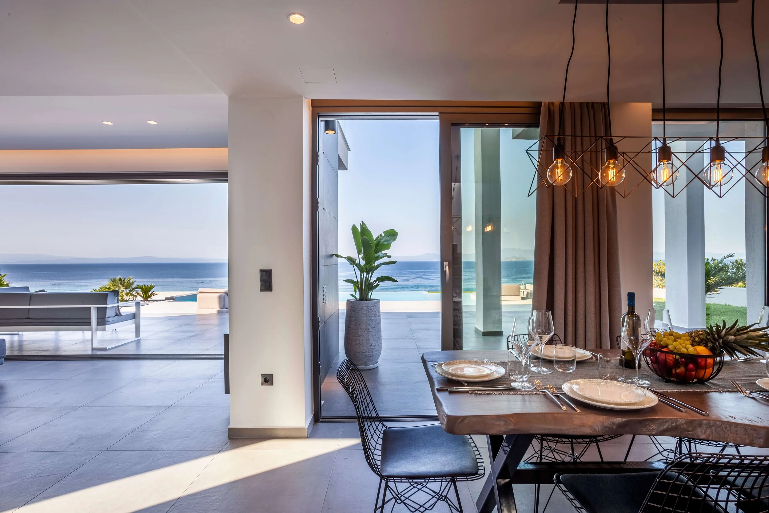 Sophisticated indoor dining room of Antonio Villa Halkidiki with elegant table setting