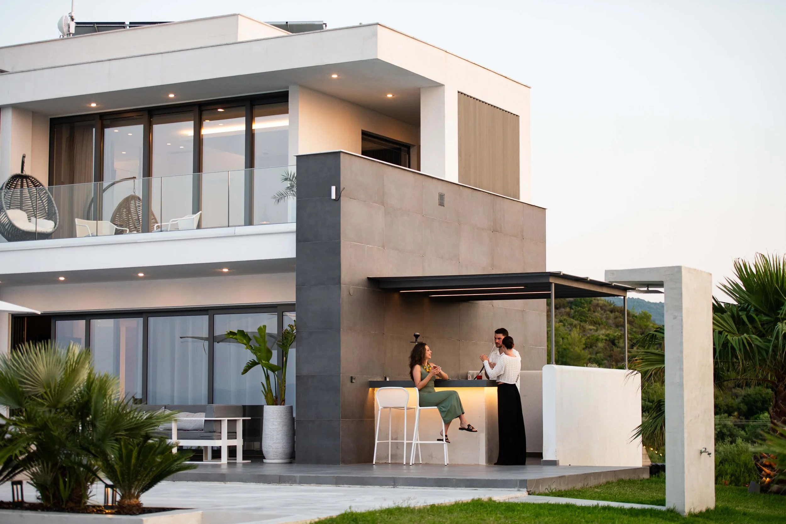 Antonio Villa Kassandra poolside bar and dining space for evening gatherings