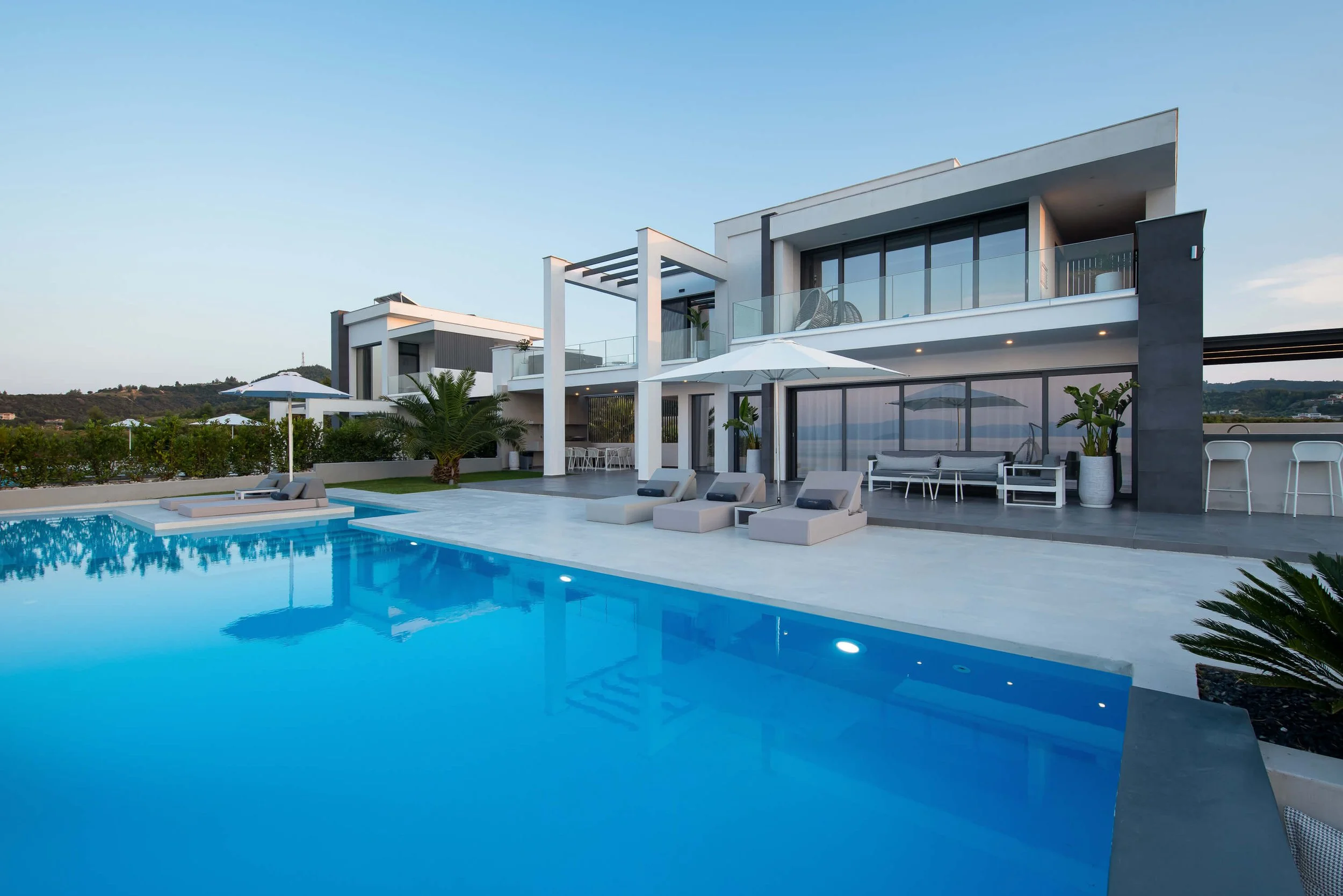 Antonio Villa Kassandra spacious pool and garden terrace overlooking the Mediterranean