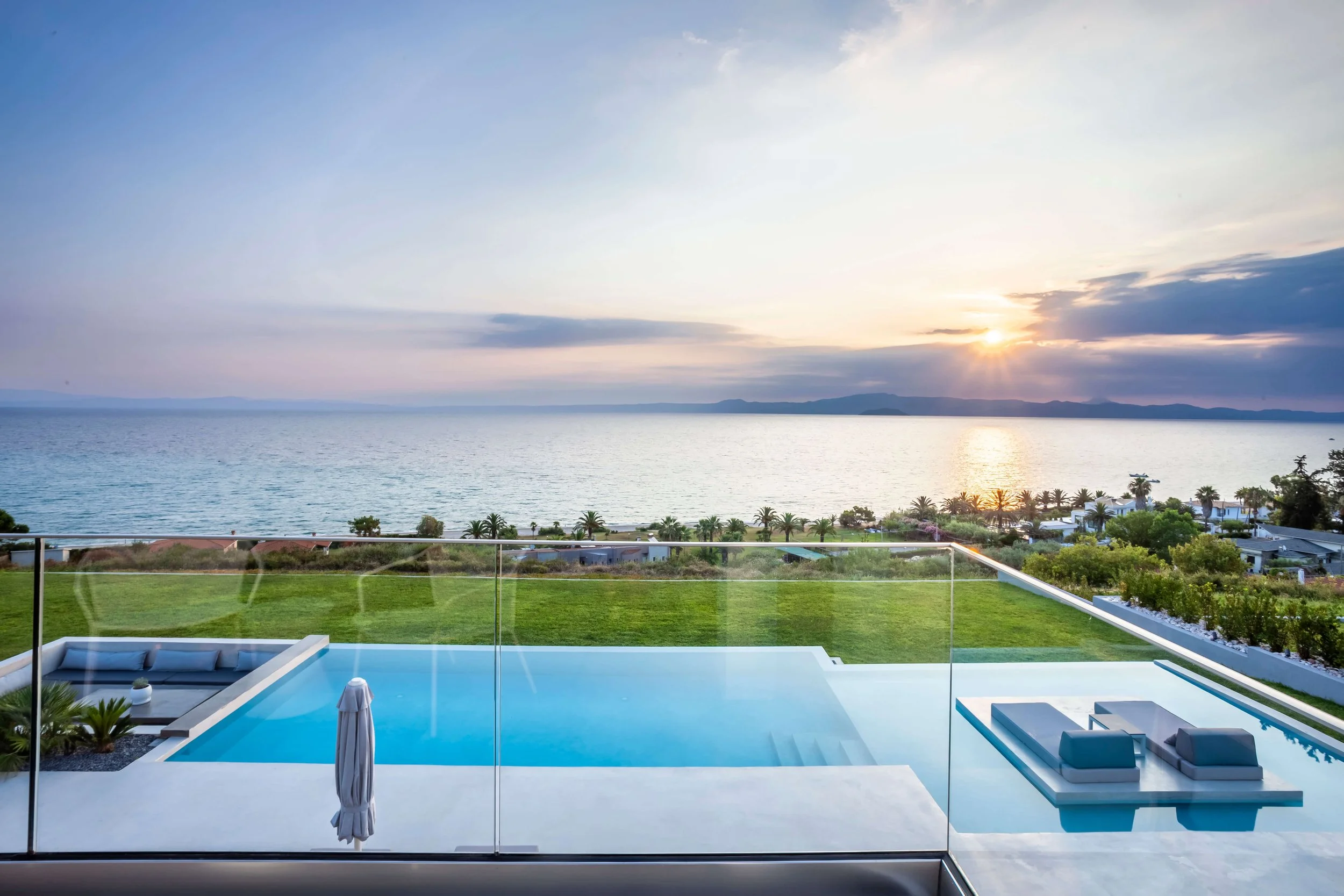 Antonio Villa Halkidiki private infinity pool blending with Aegean sea view at sunset Kassandra
