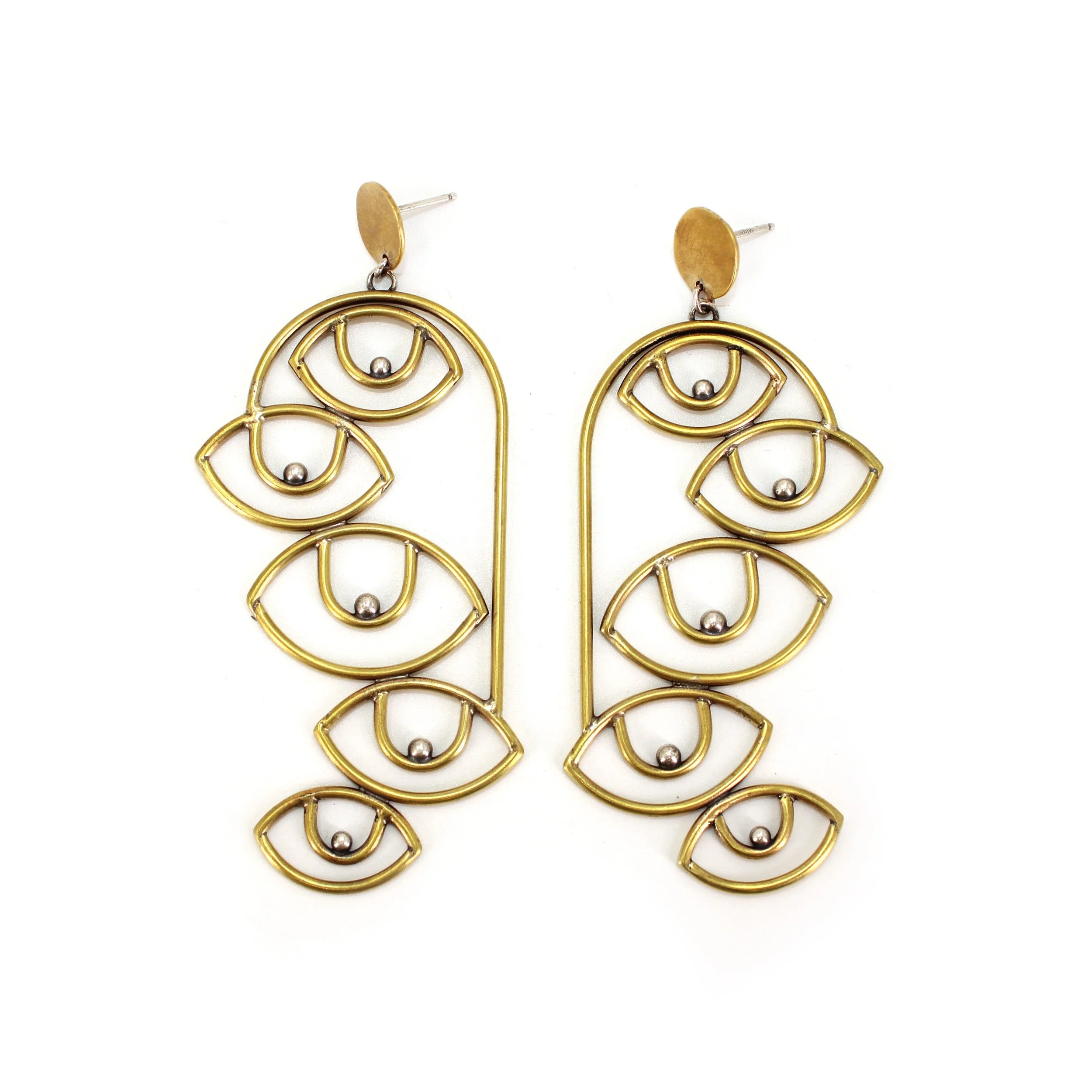 Gold earrings designed with multiple eye-shaped wire outlines and small metal balls in the center of each eye.
