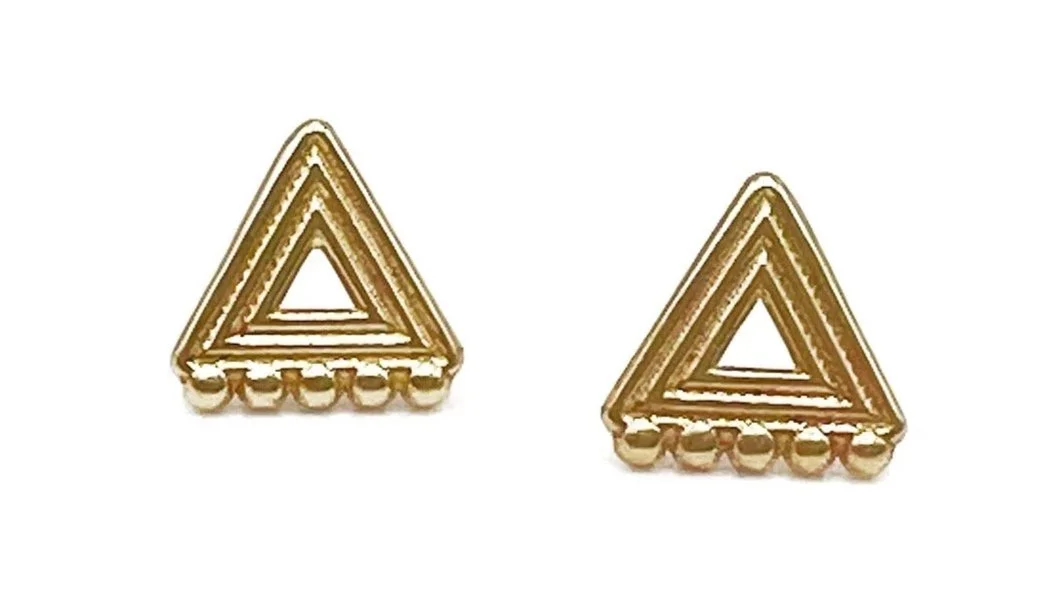 Pair of gold triangular-shaped earrings with a layered, geometric design.