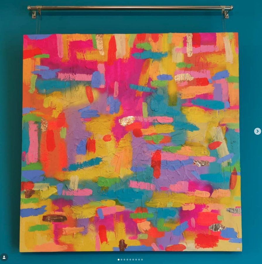 Colorful abstract painting with bright pink, yellow, orange, blue, green, purple, and metallic accents on a turquoise background.