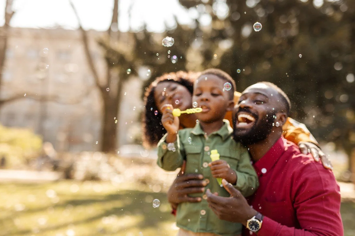 Family blowing bubbles