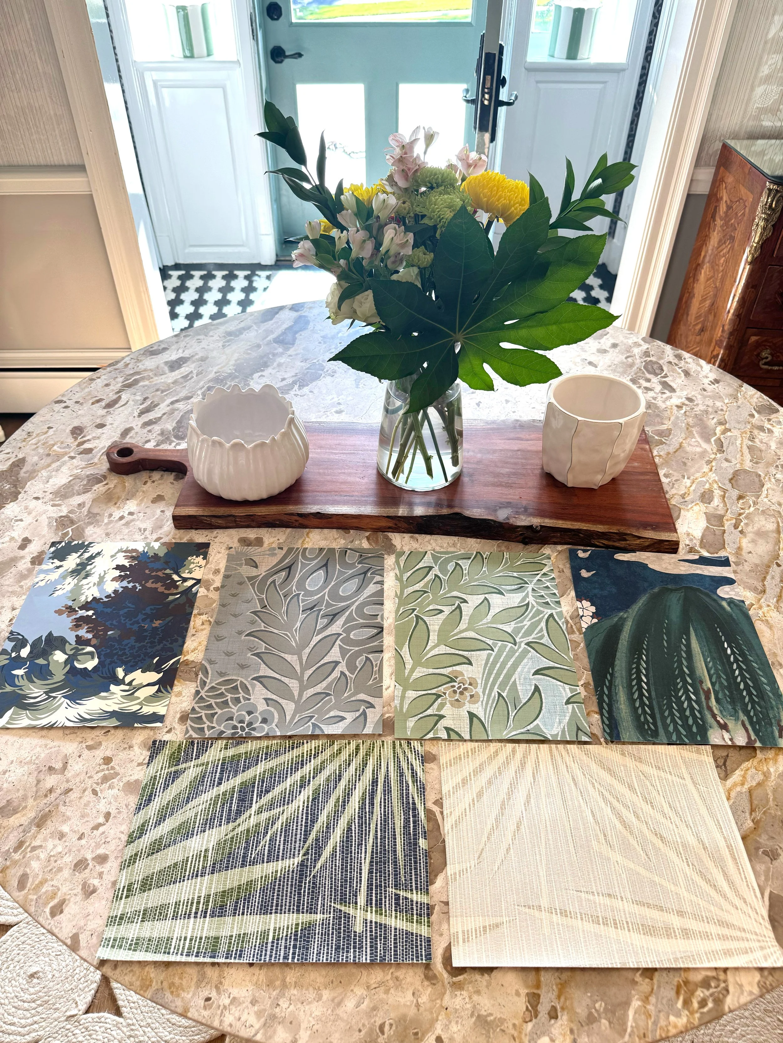 Interior styling scene with fabric samples and décor elements curated by Visceral by Design High Point NC