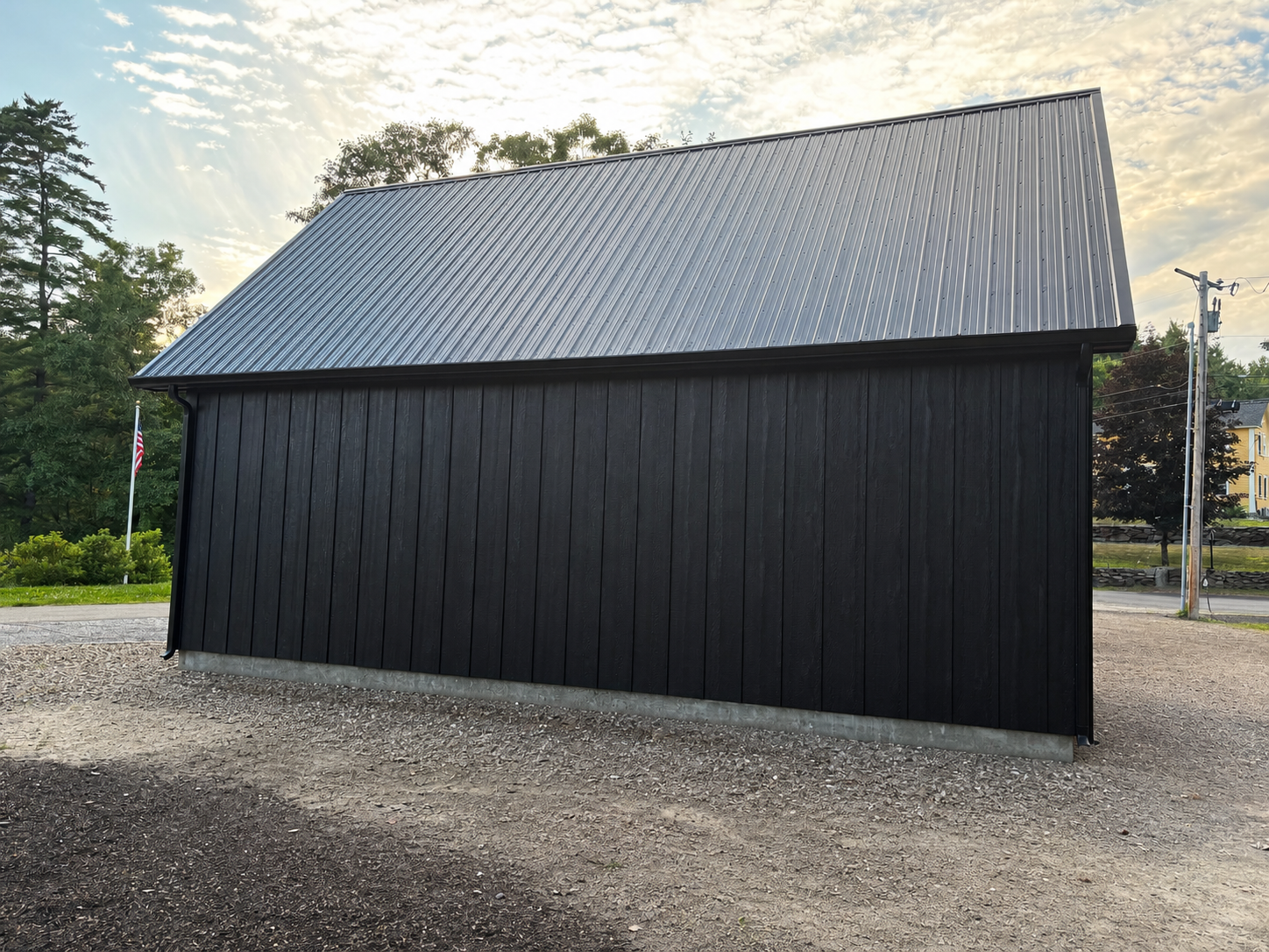 LP® SmartSide® Diamond Kote® Board & Batten siding paired with handcrafted barn doors creates a classic New England look that's built to withstand New Hampshire's weather.
