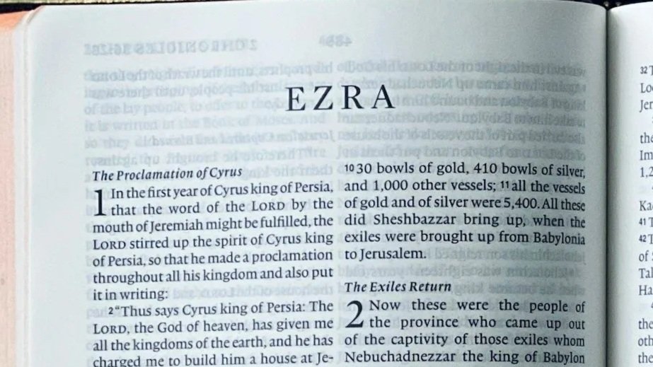 Photograph of an open Bible showing the book of Ezra, accompanying the blog post 'How to Study the Book of Ezra