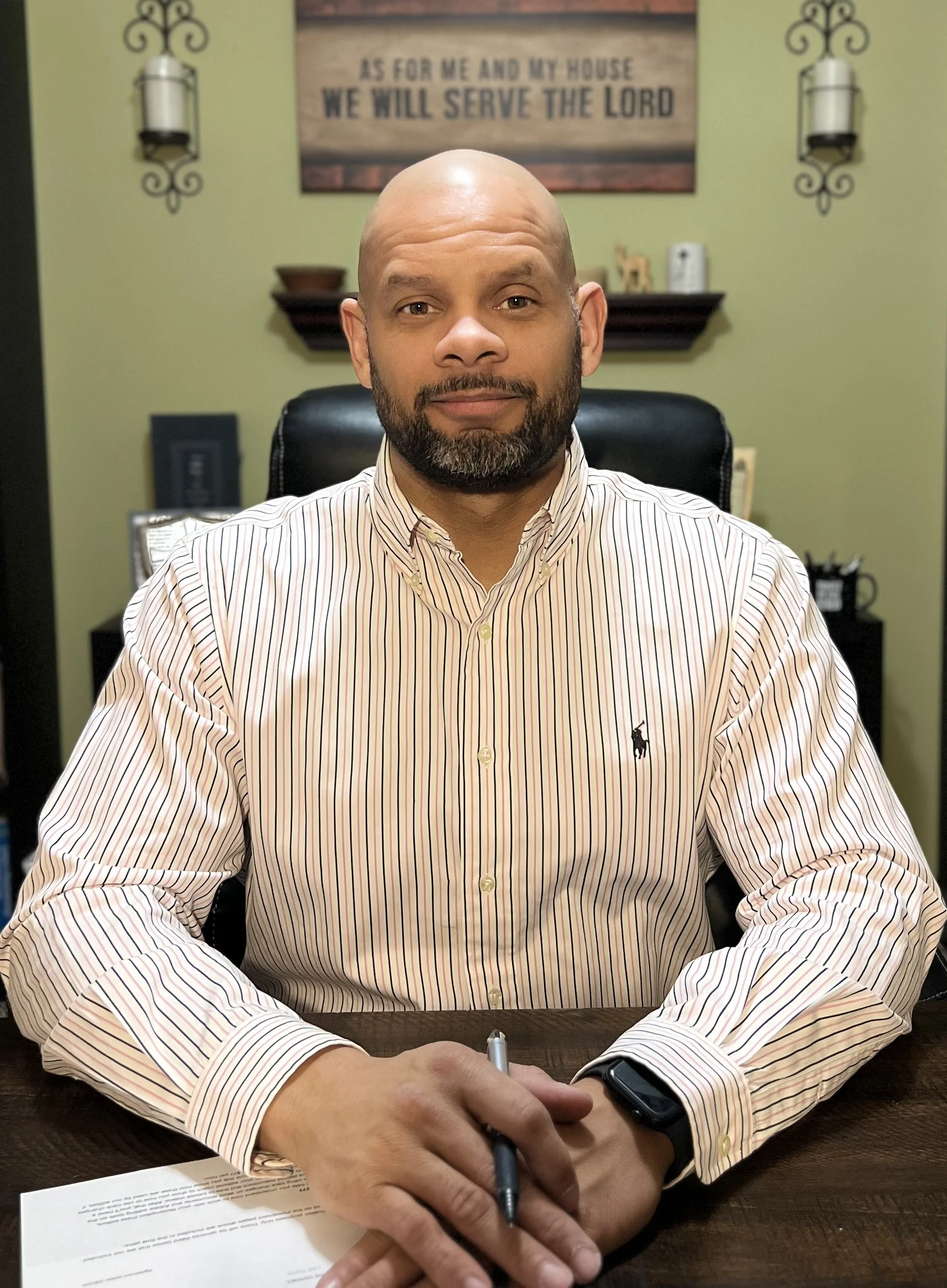 Tony Smith, author of Exploring Ezra, at his desk with an open Bible