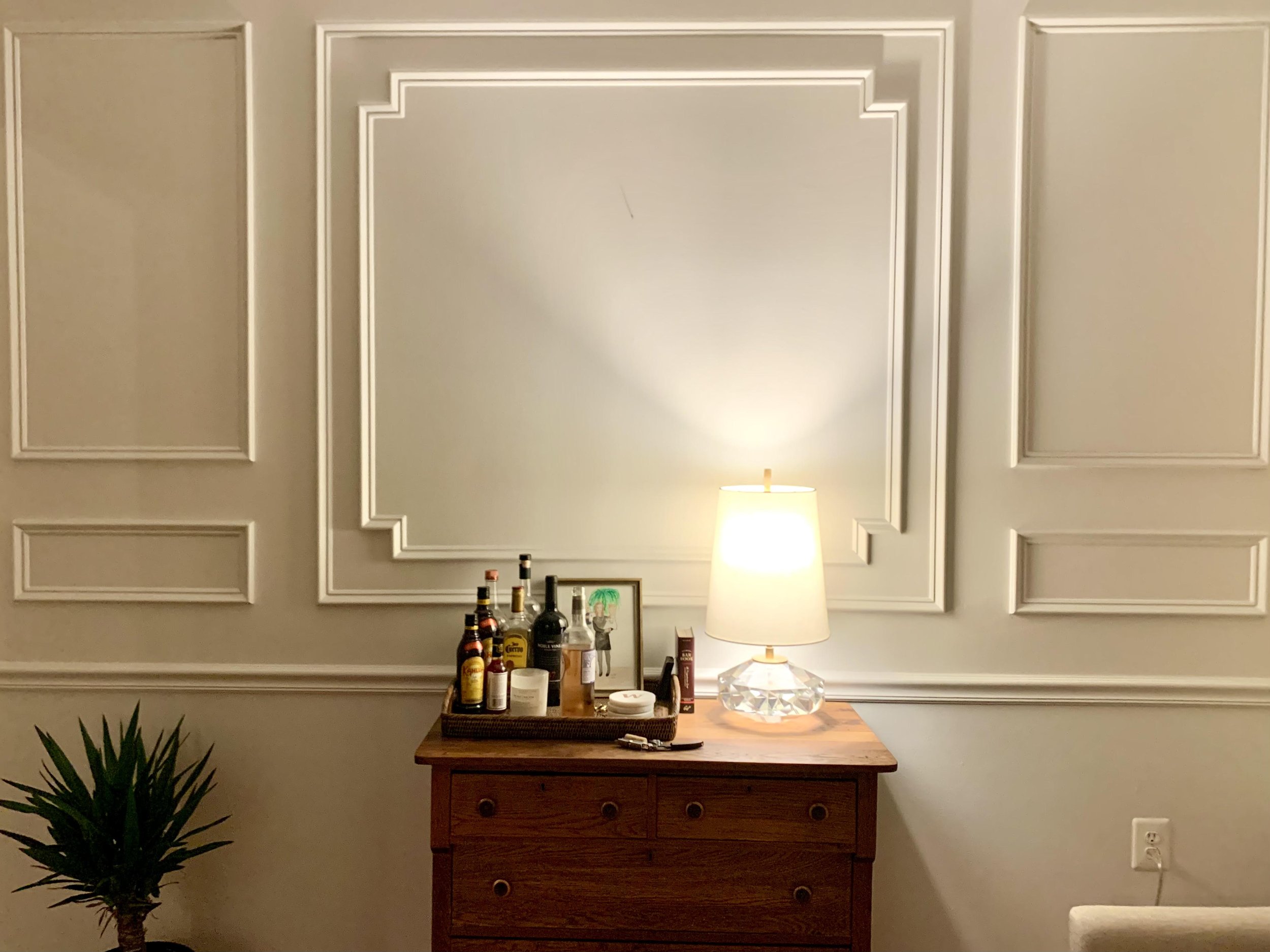 picture frame molding on this feature wall adds texture