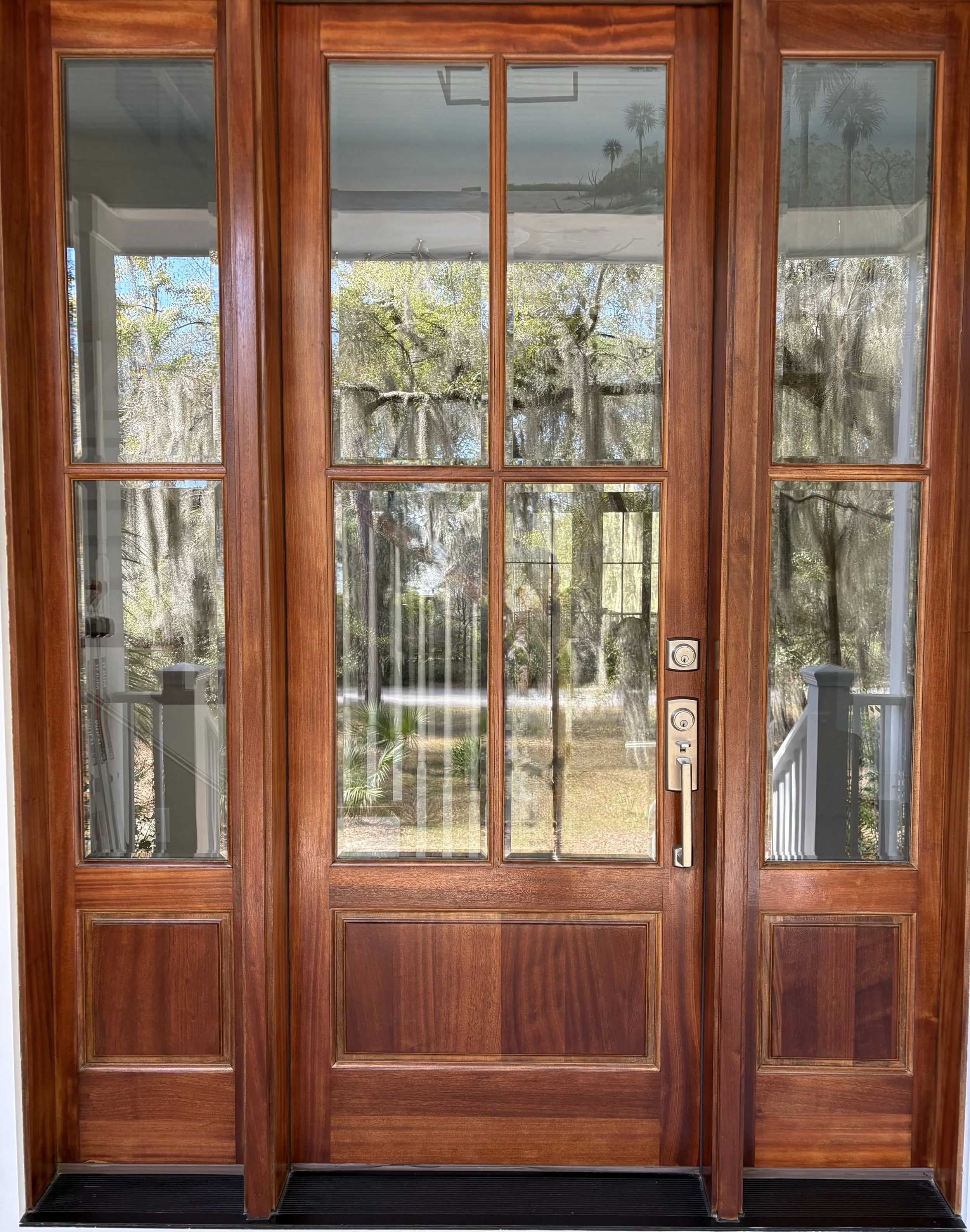 Large entry door with side lights