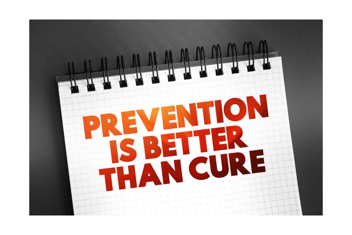 Un carnet de notes avec le message "Prevention is better than cure" écrit en lettres rouges et orange.
