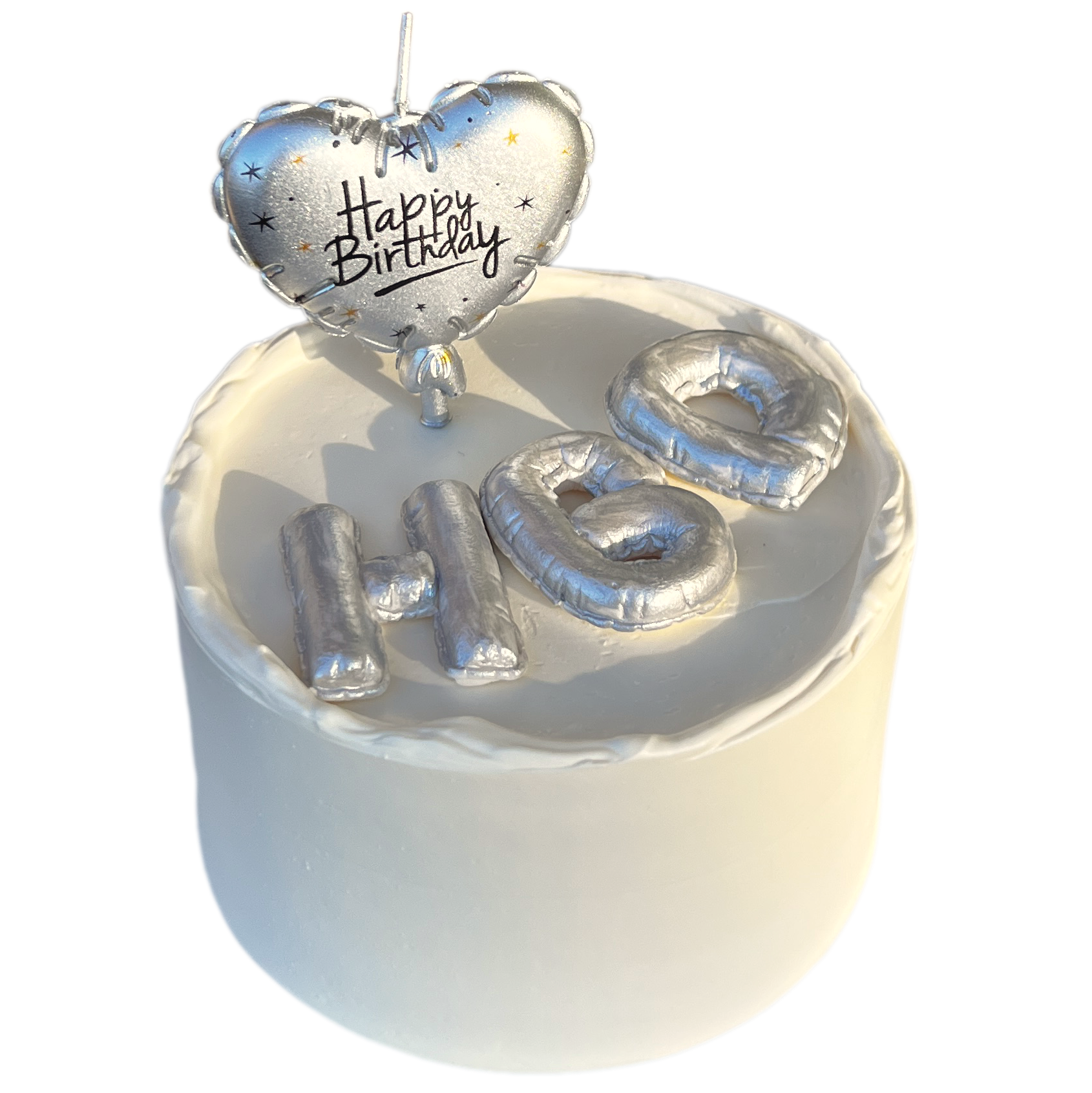 White birthday cake with silver 