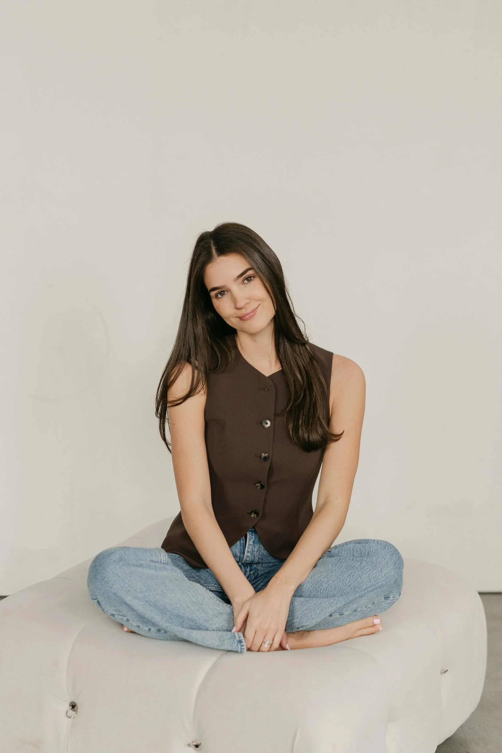 Woman resting in a peaceful space, representing emotional support during postpartum healing