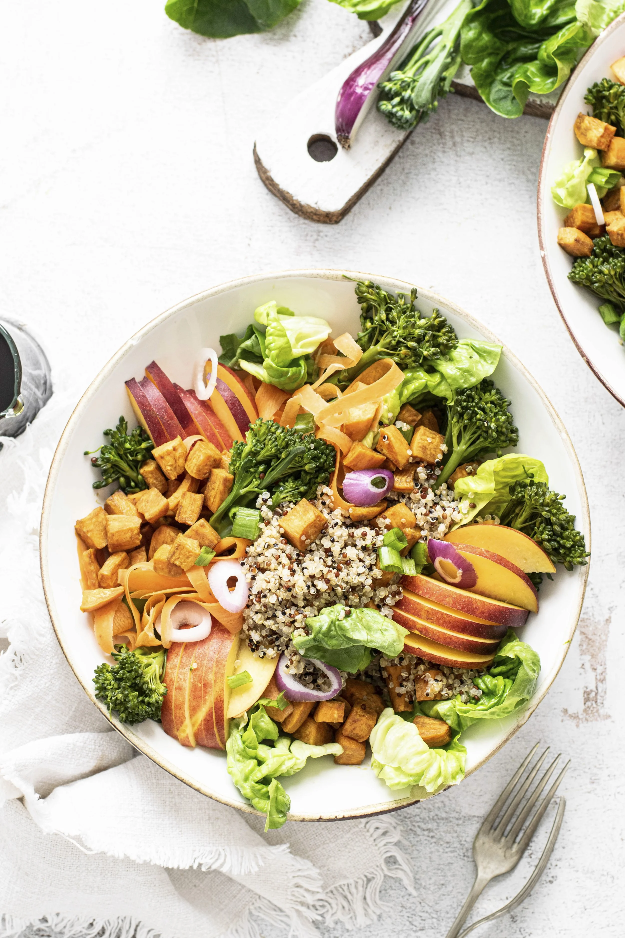 sweet-potato-buddha-bowl-white-table-flat-lay.jpg