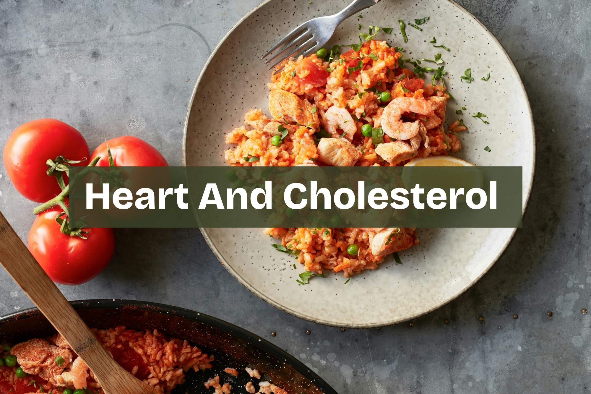 A plate of cooked rice with shrimp, chicken, peas, and chopped herbs, with a wedge of lemon, on a gray surface. Three tomatoes are on the side. heart friendly meal with healthy fats and balanced nutrients Nourix. low cholesterol meal.